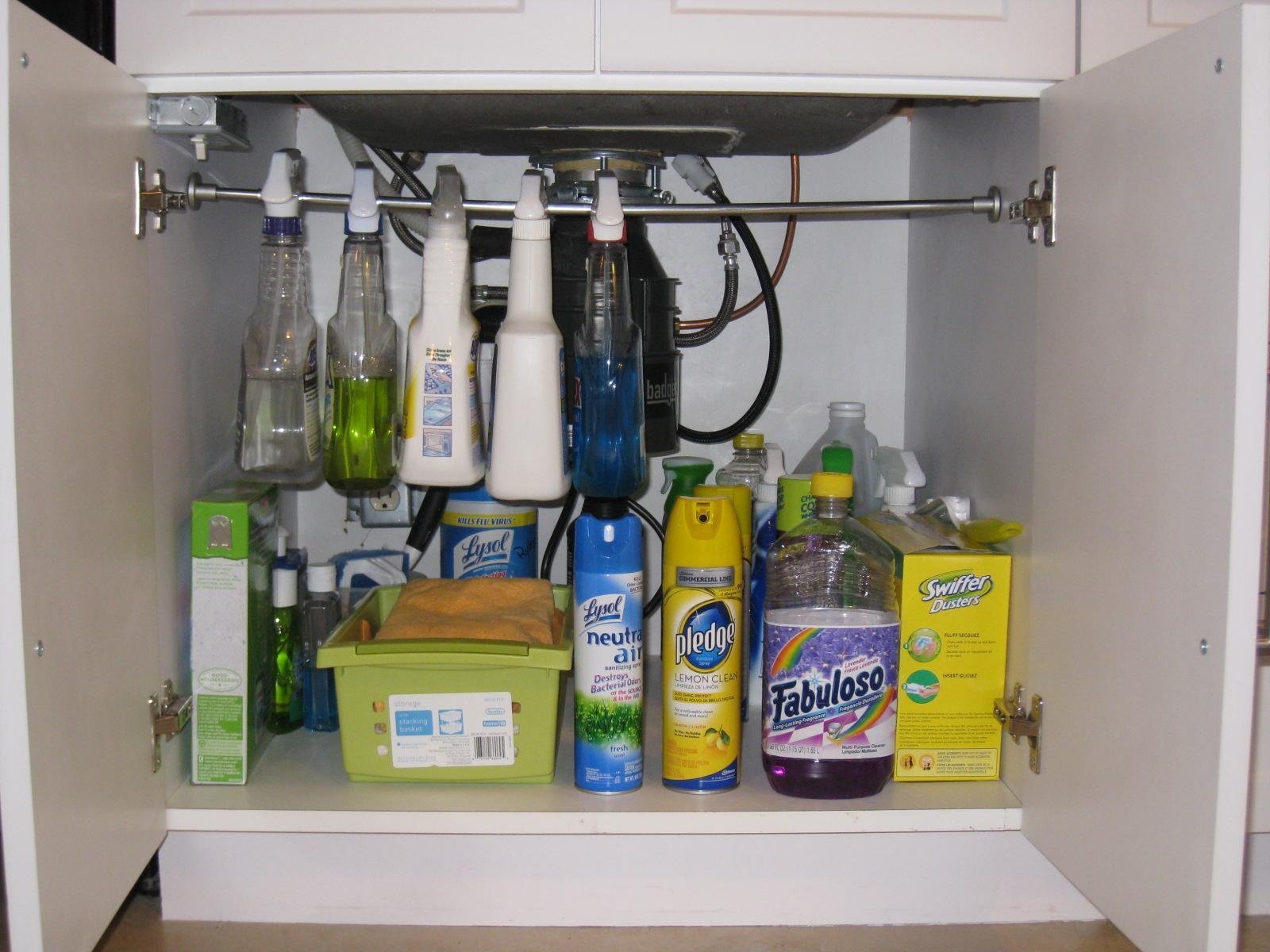 HANG A TENSION ROD UNDERNEATH THE KITCHEN SINK