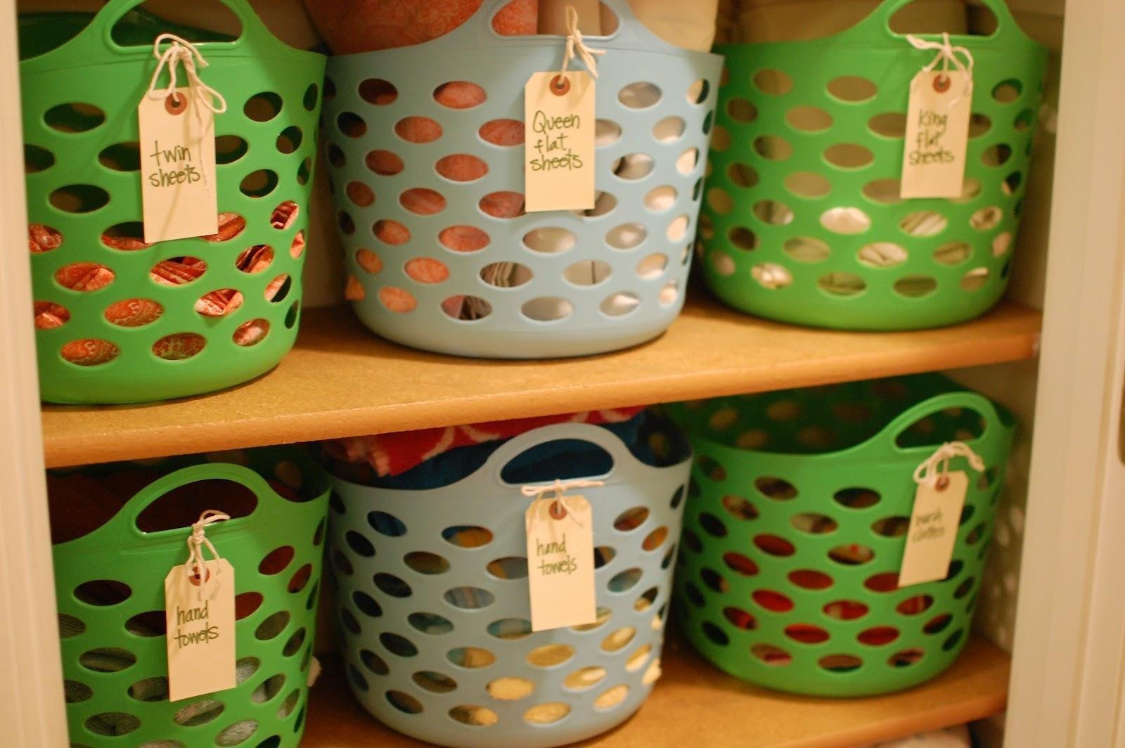 PICK UP DOLLAR-STORE BASKETS TO ORGANIZE YOUR LINEN CLOSET