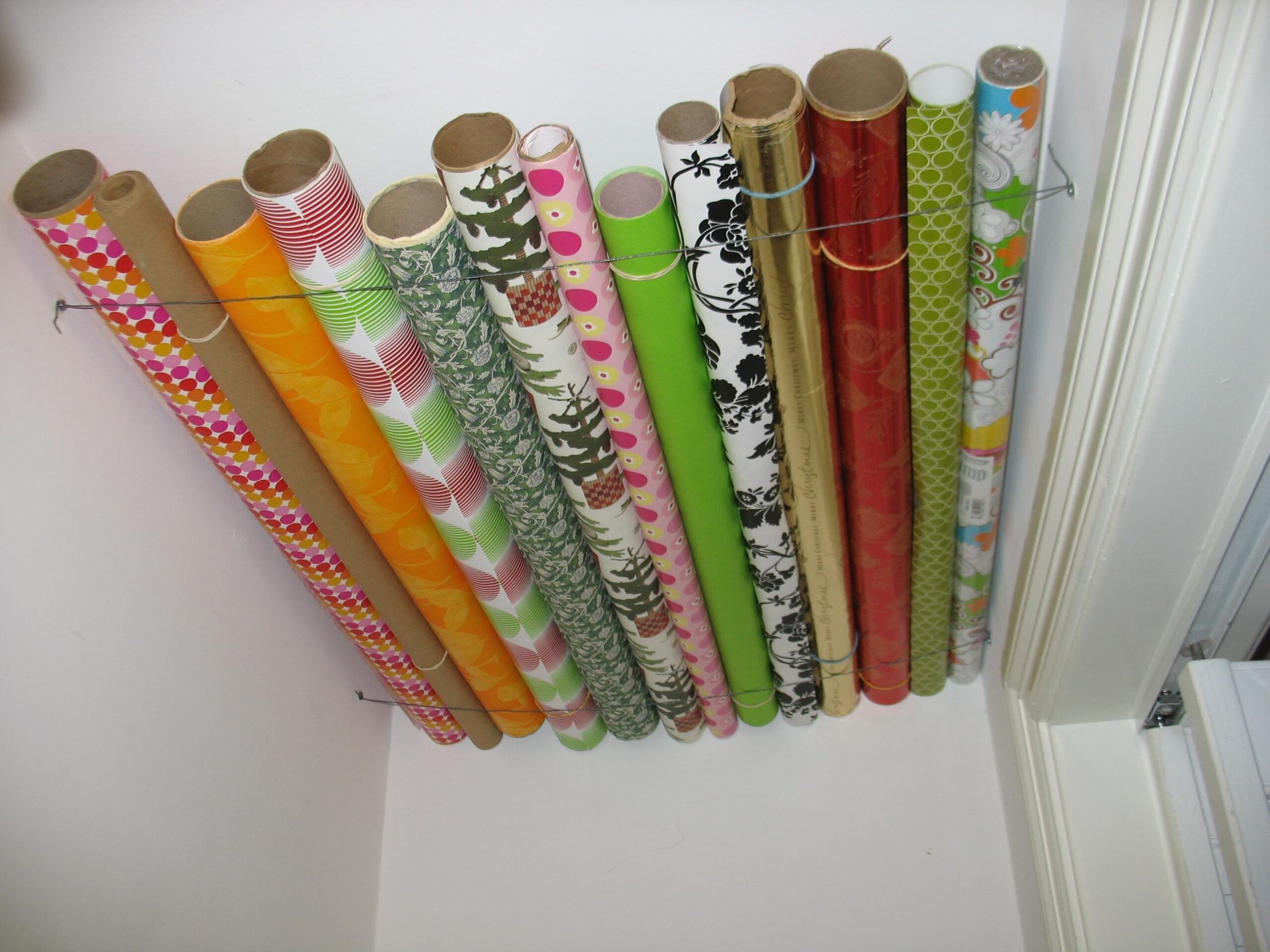 USE PIECES OF WIRE TO HOLD UP WRAPPING PAPER