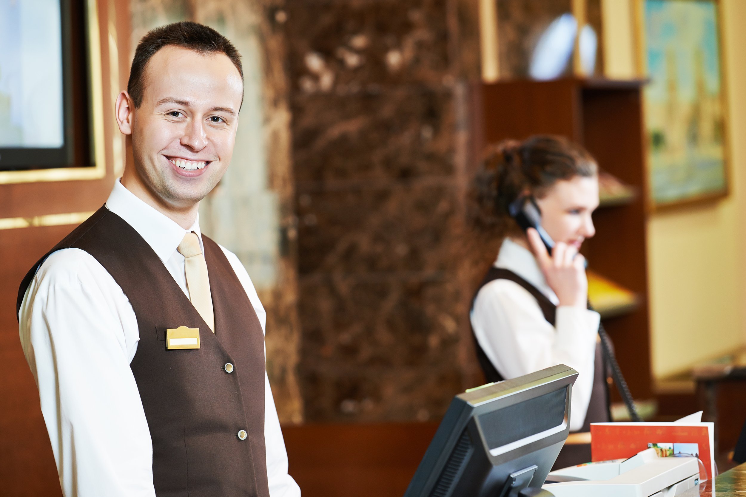 man at hotel counter