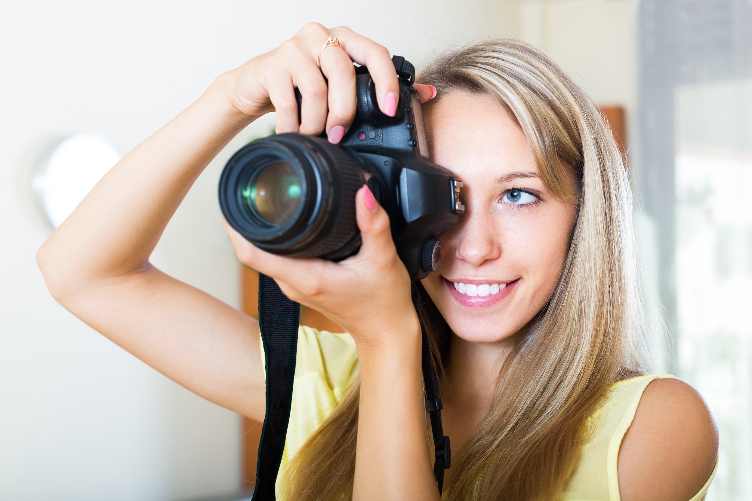 woman taking a photo with a dslr camera