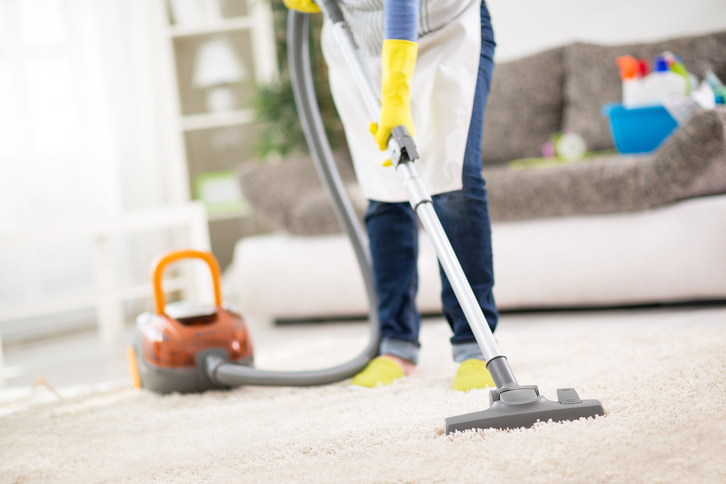 woman vacuuming carpet