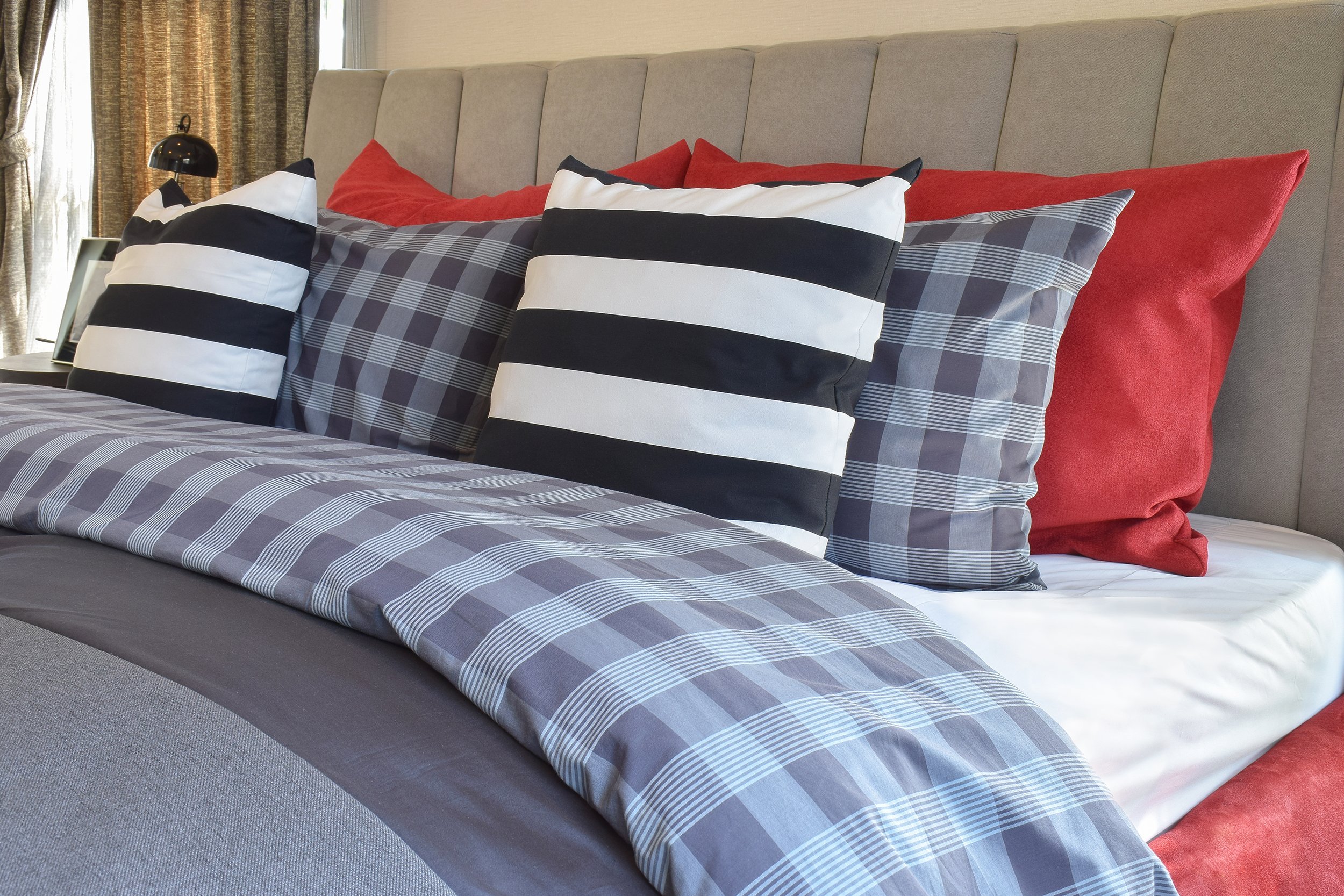 bed with sheets, bedspread, and pillows