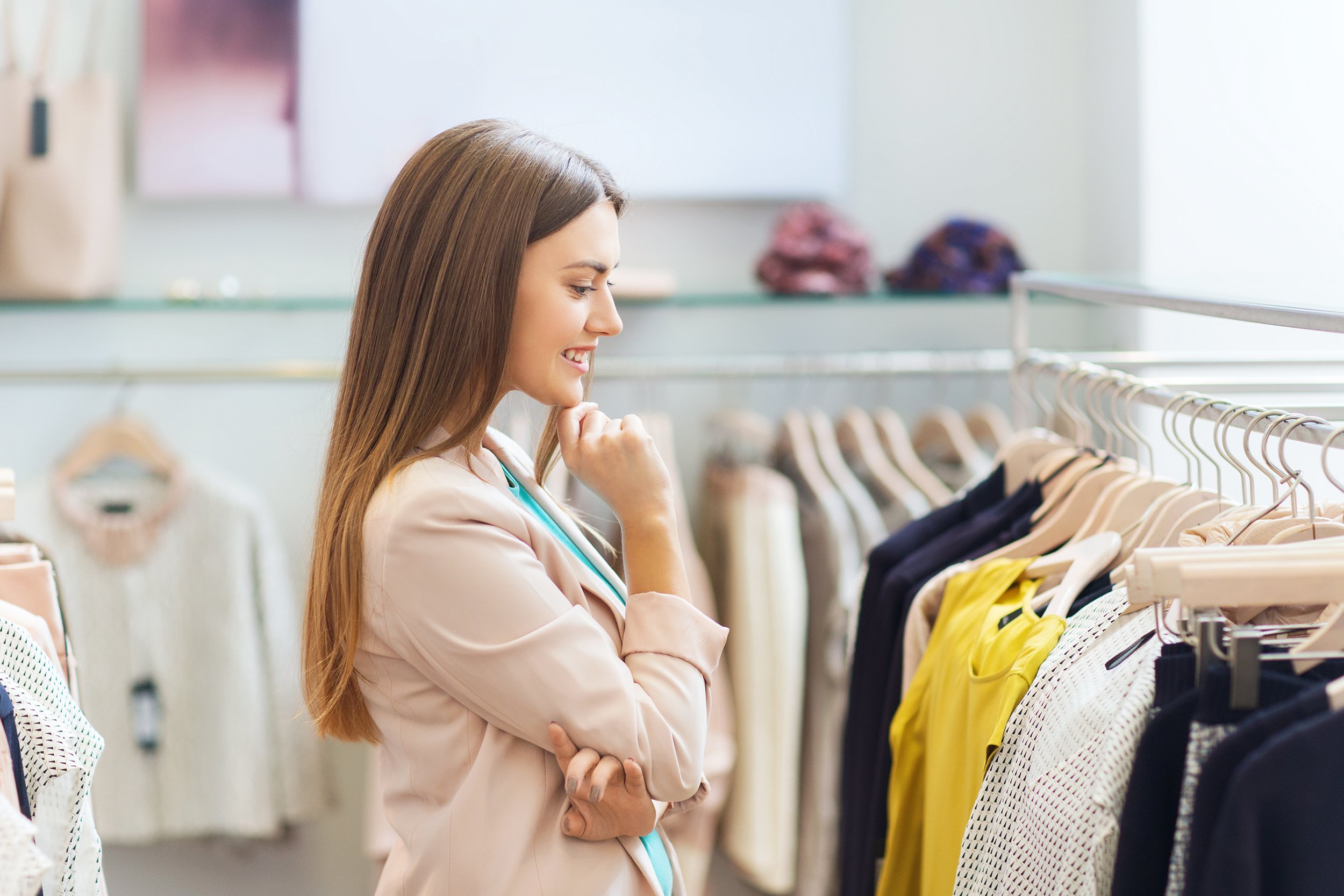 woman comparison shopping clothes