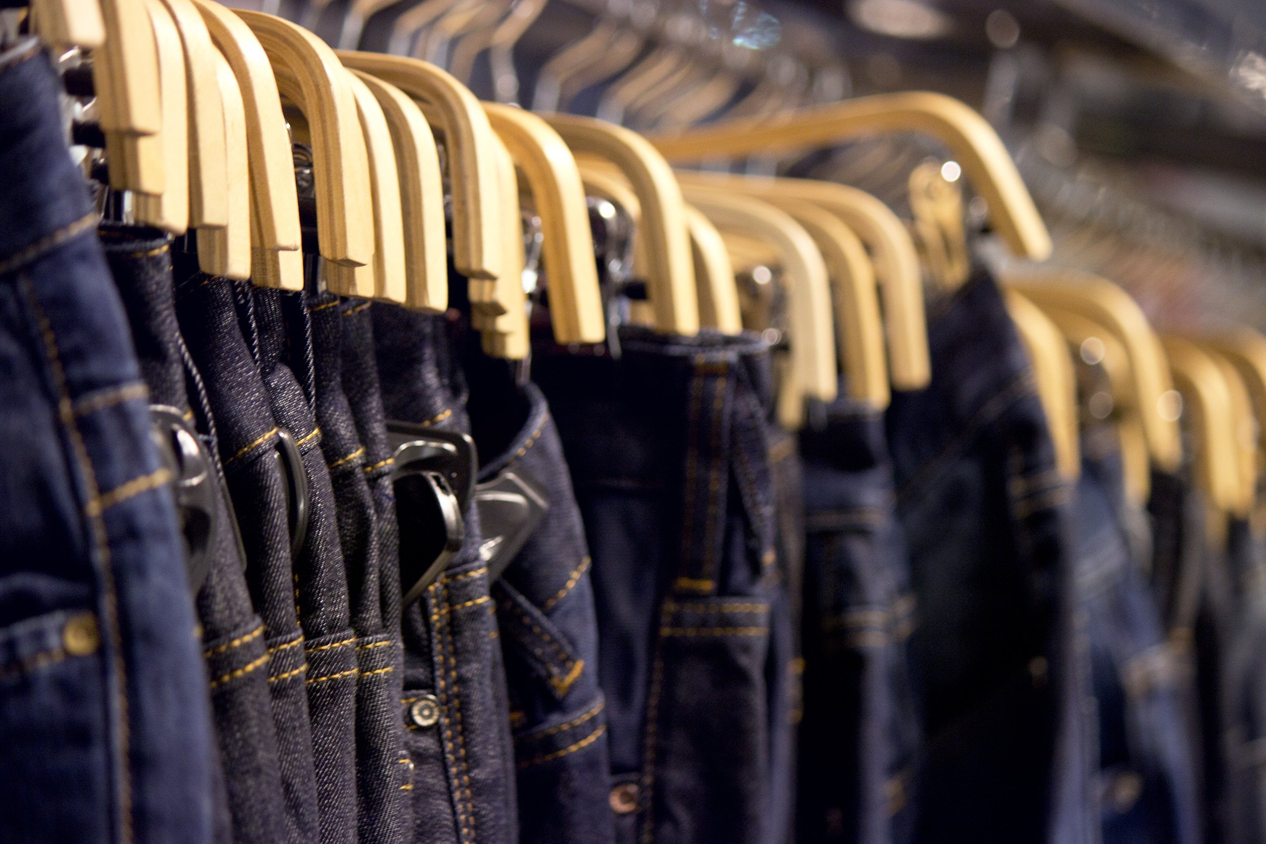 denim jeans hanging in a store