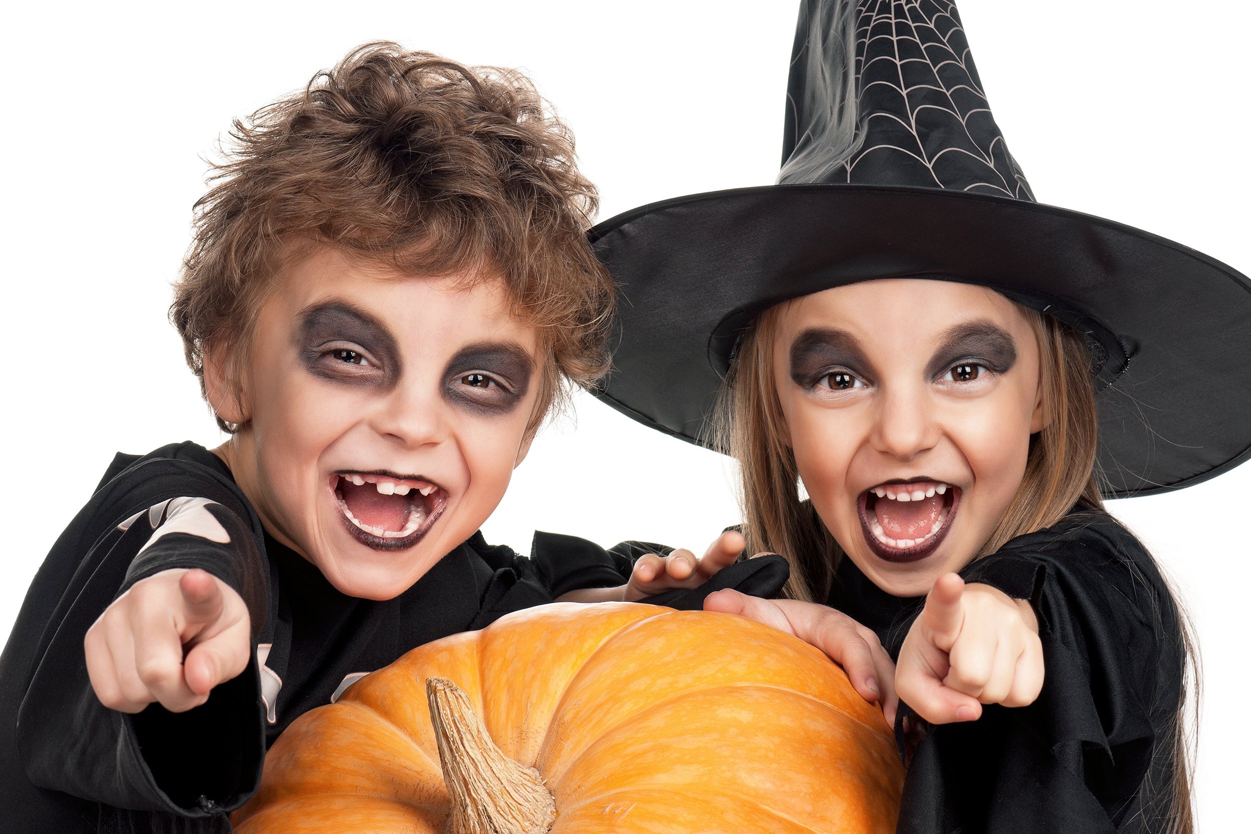 boy and girl wearing halloween costume with pumpkin