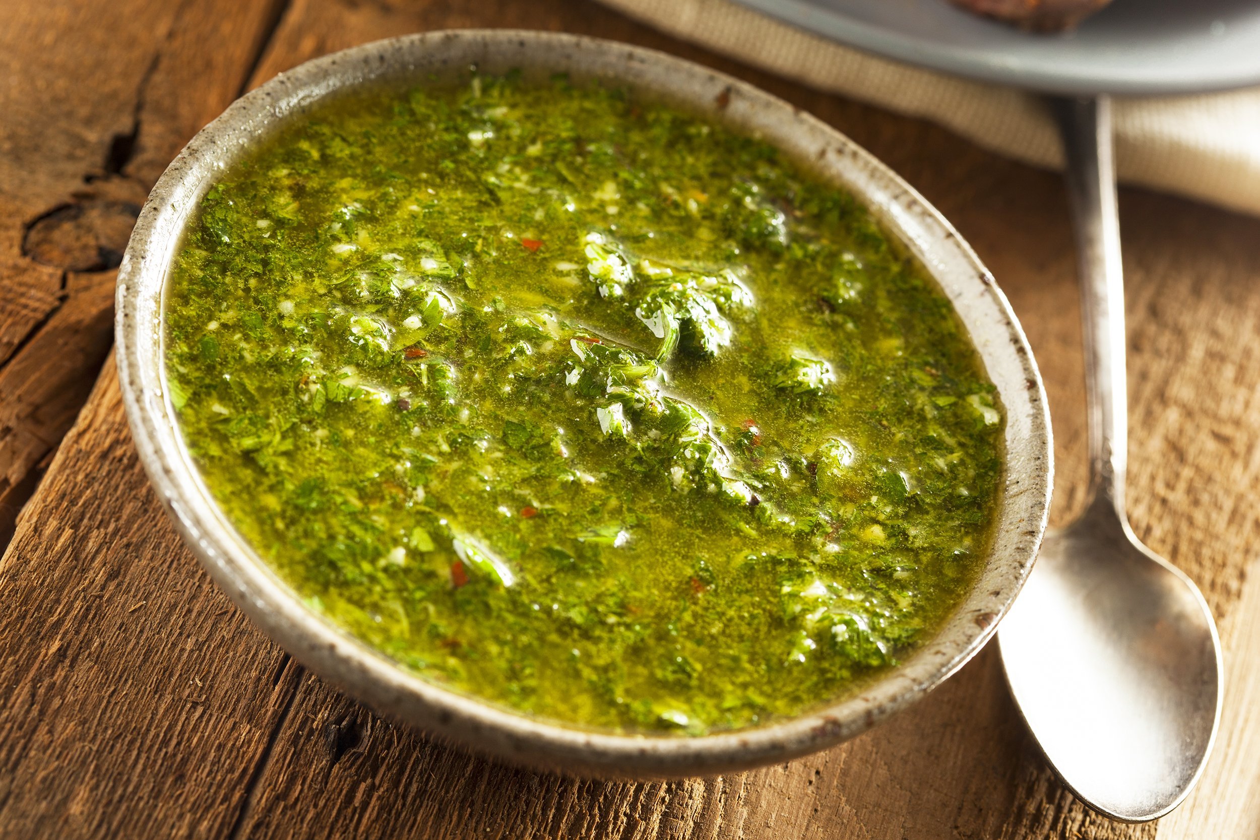 homemade green chimichurri sauce in a bowl