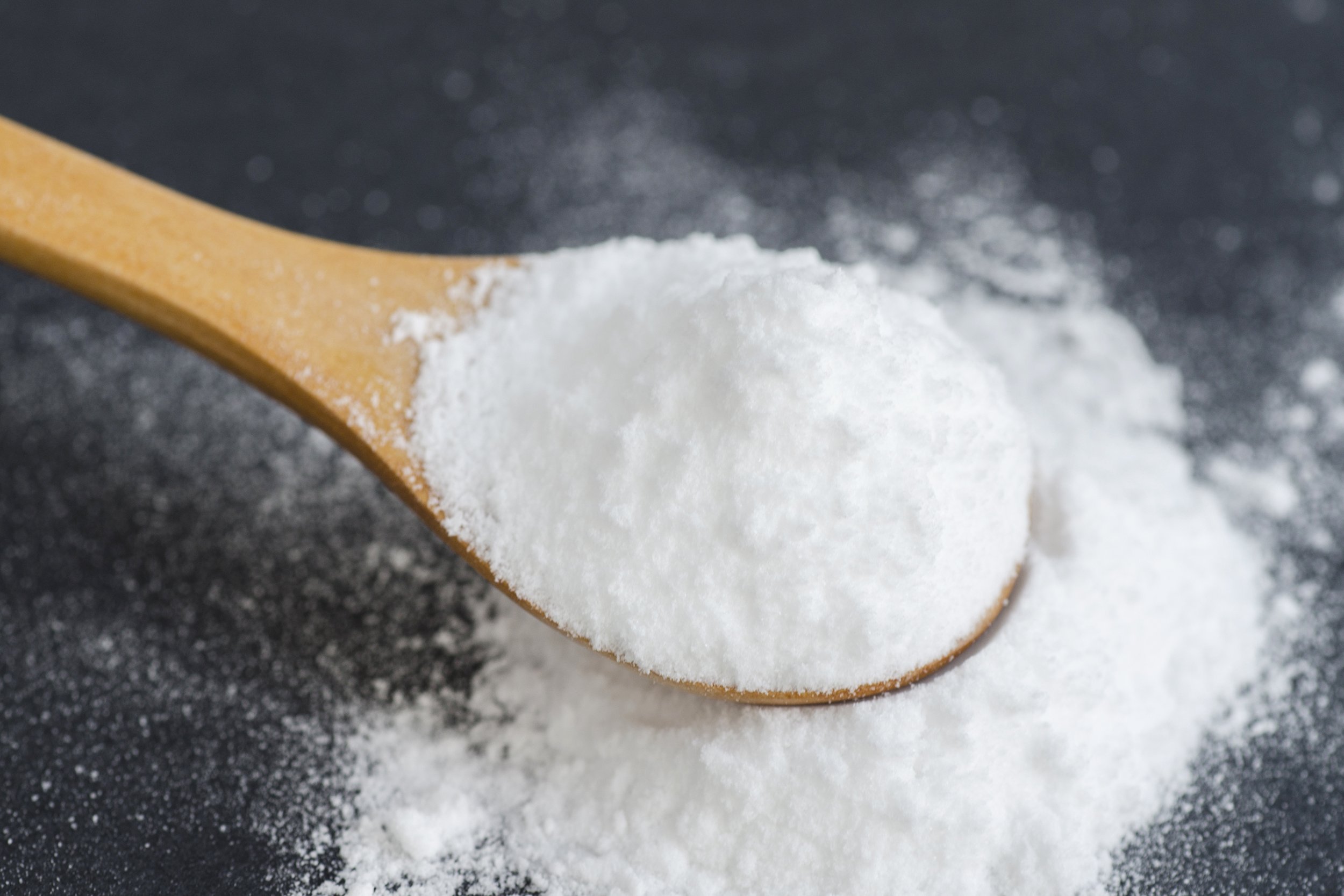 baking soda in wooden spoon