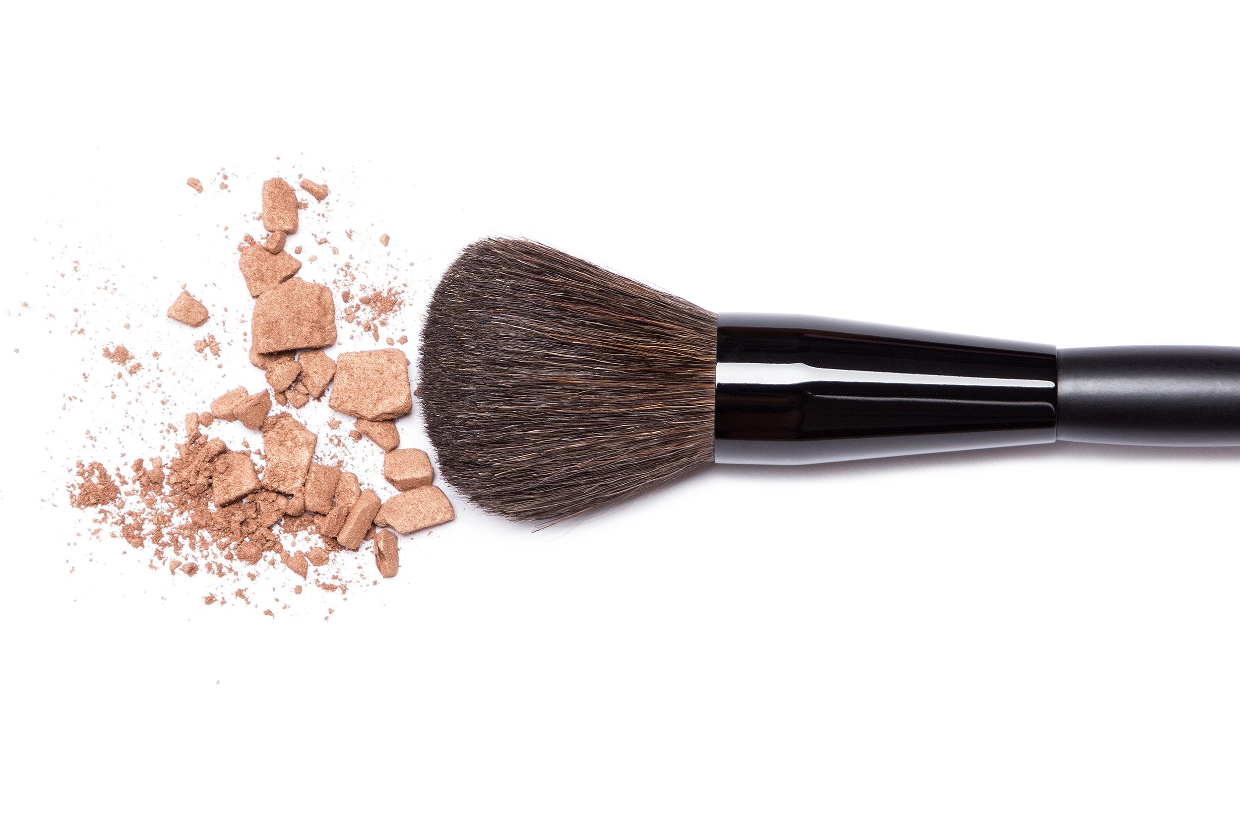 close-up of crushed bronzing powder with makeup brush