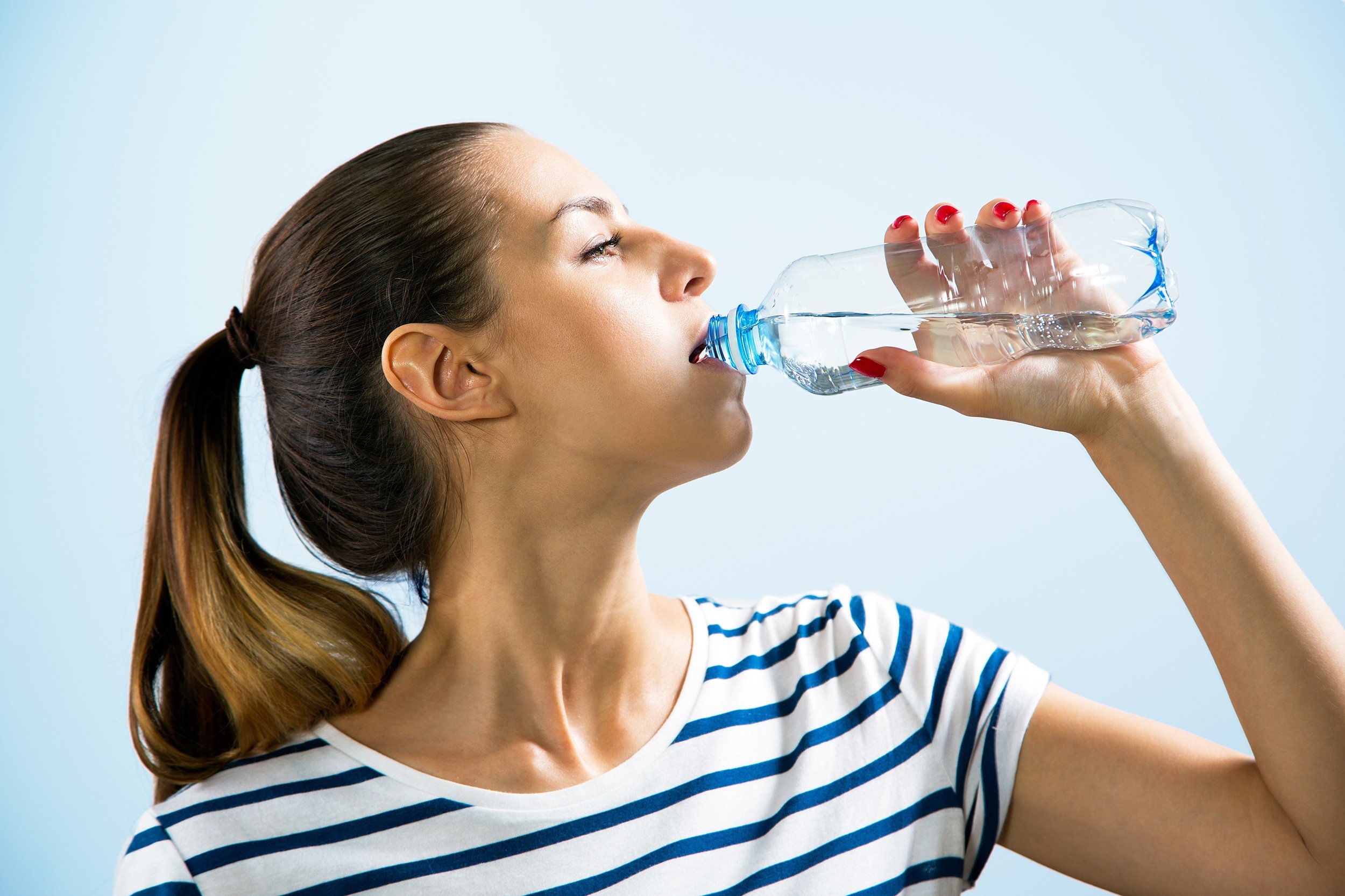 young woman drinking water