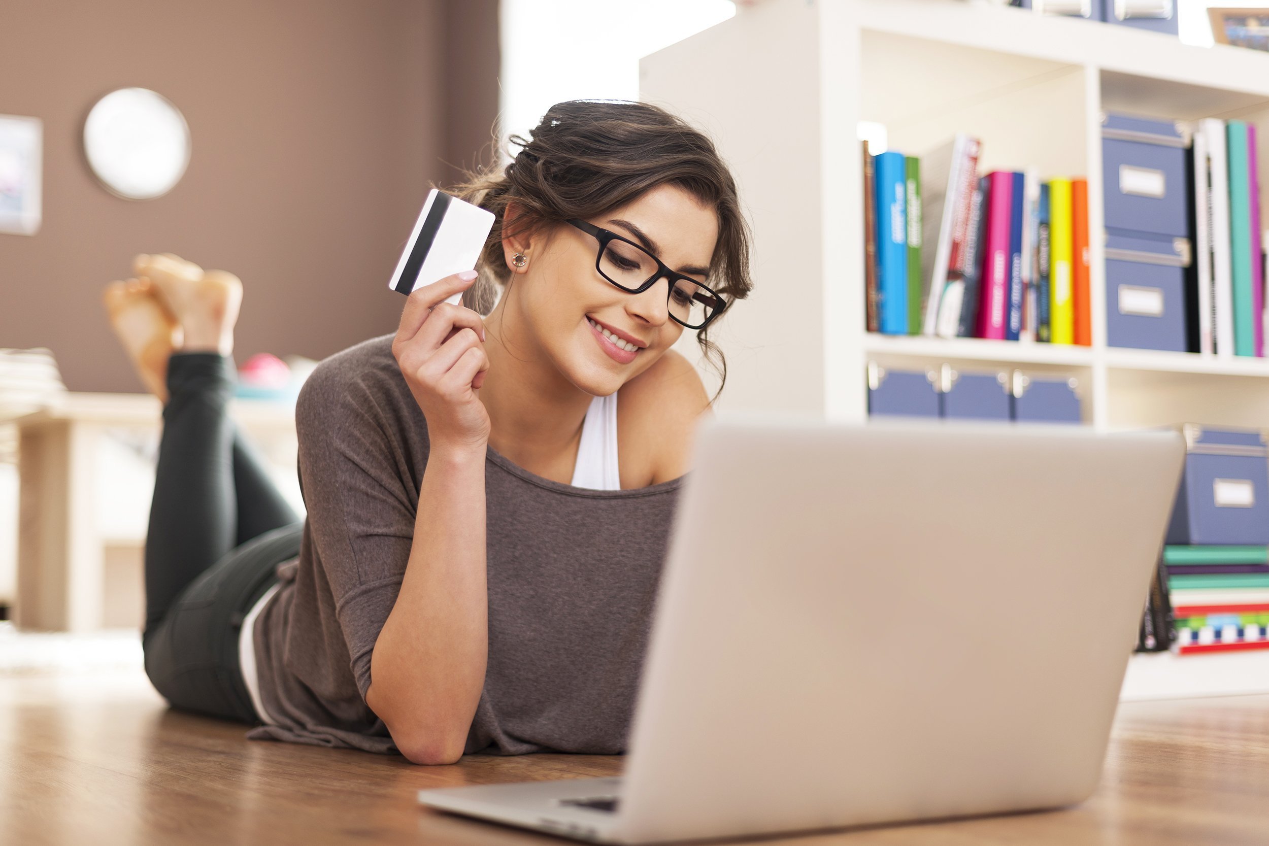 happy woman doing online shopping at home