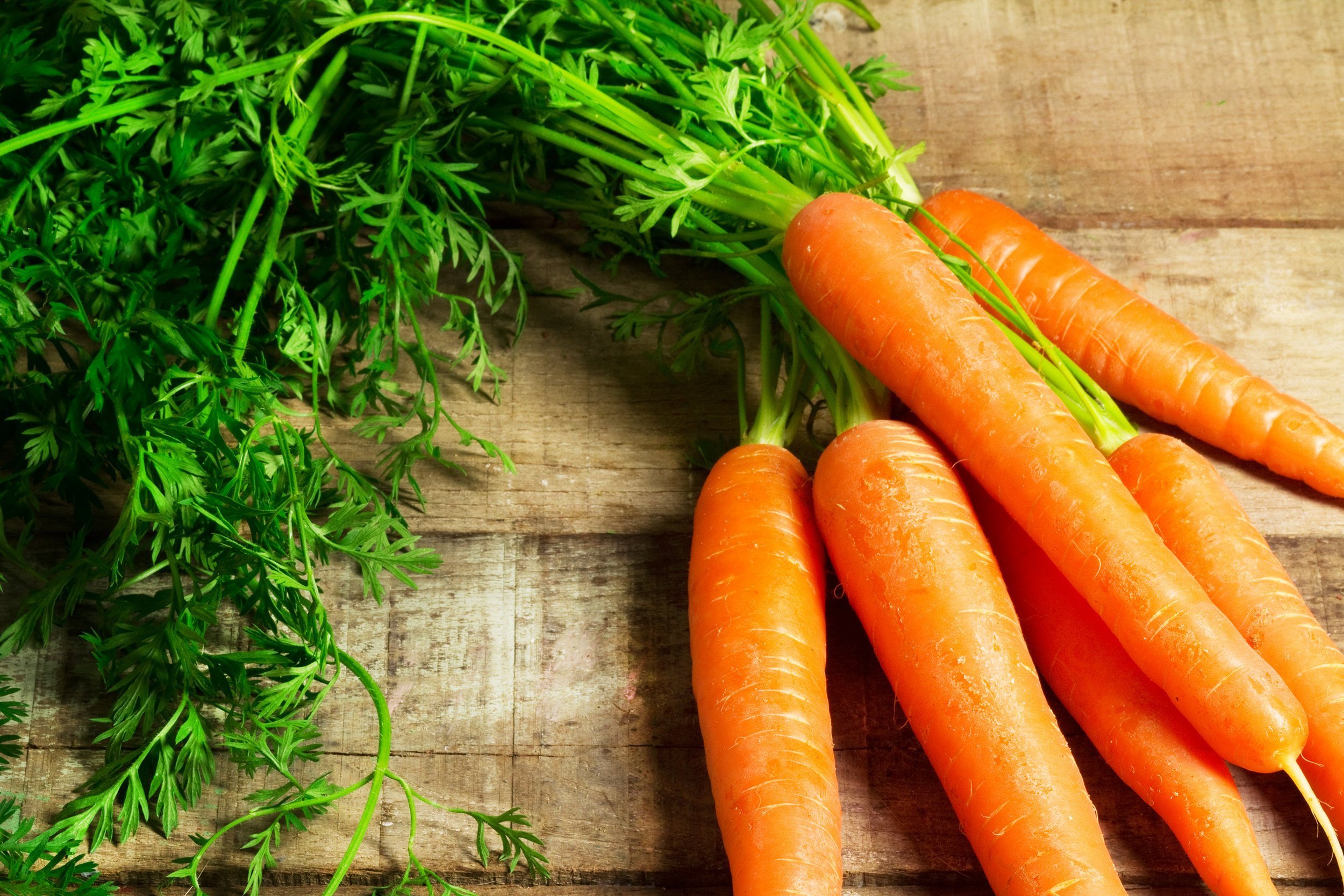 carrots on wooden background