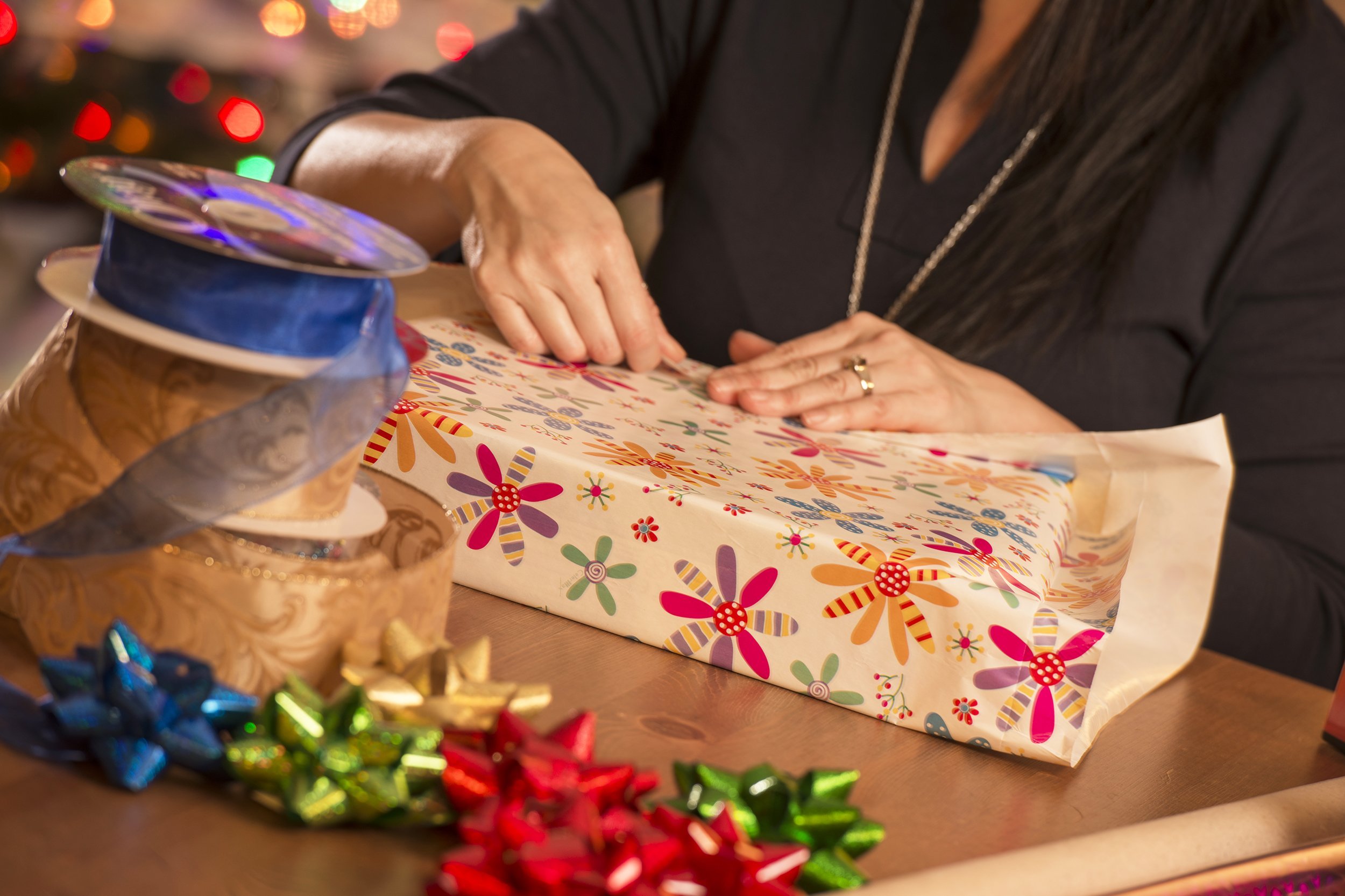 woman wrapping Christmas gifts