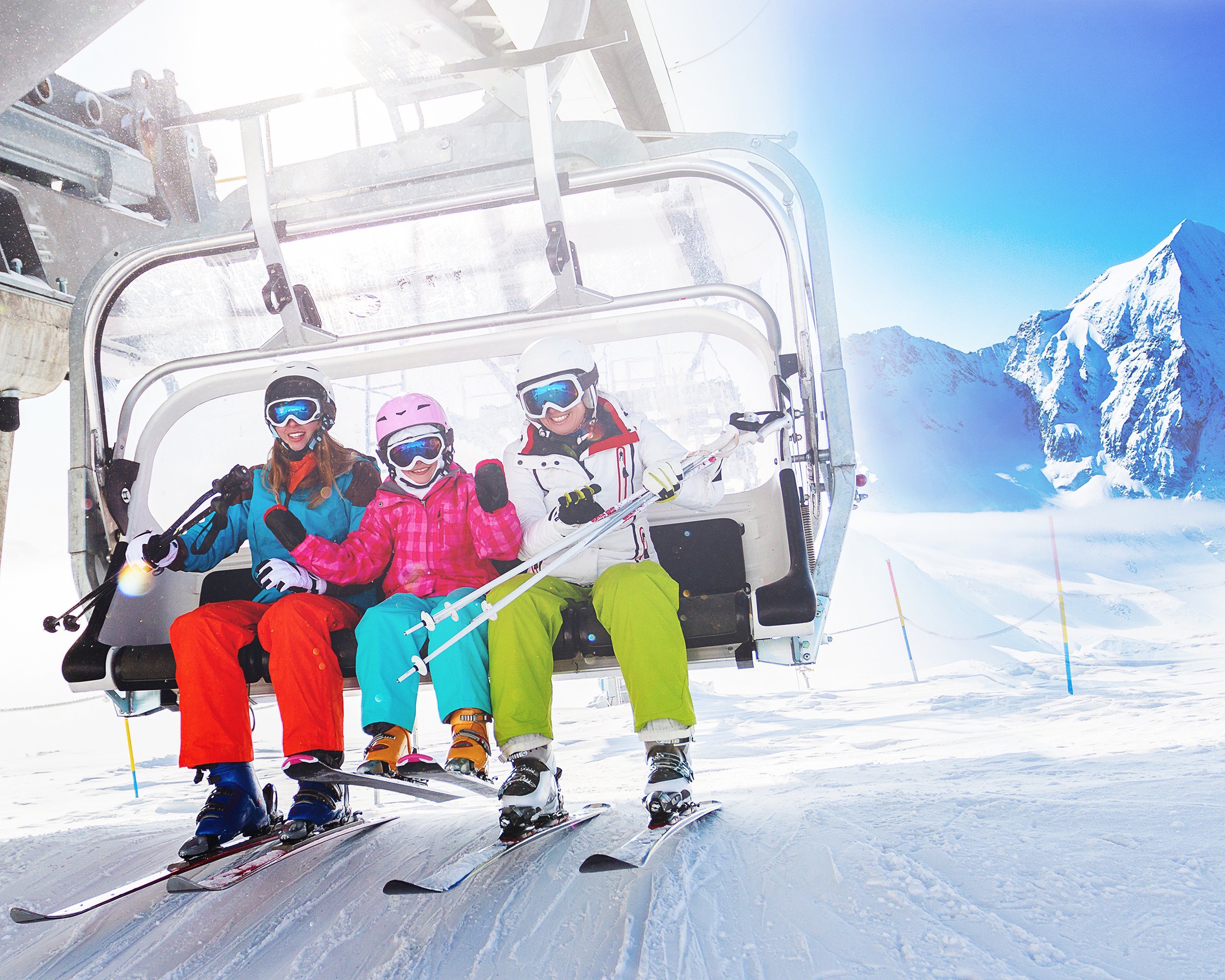 skiers on ski lift