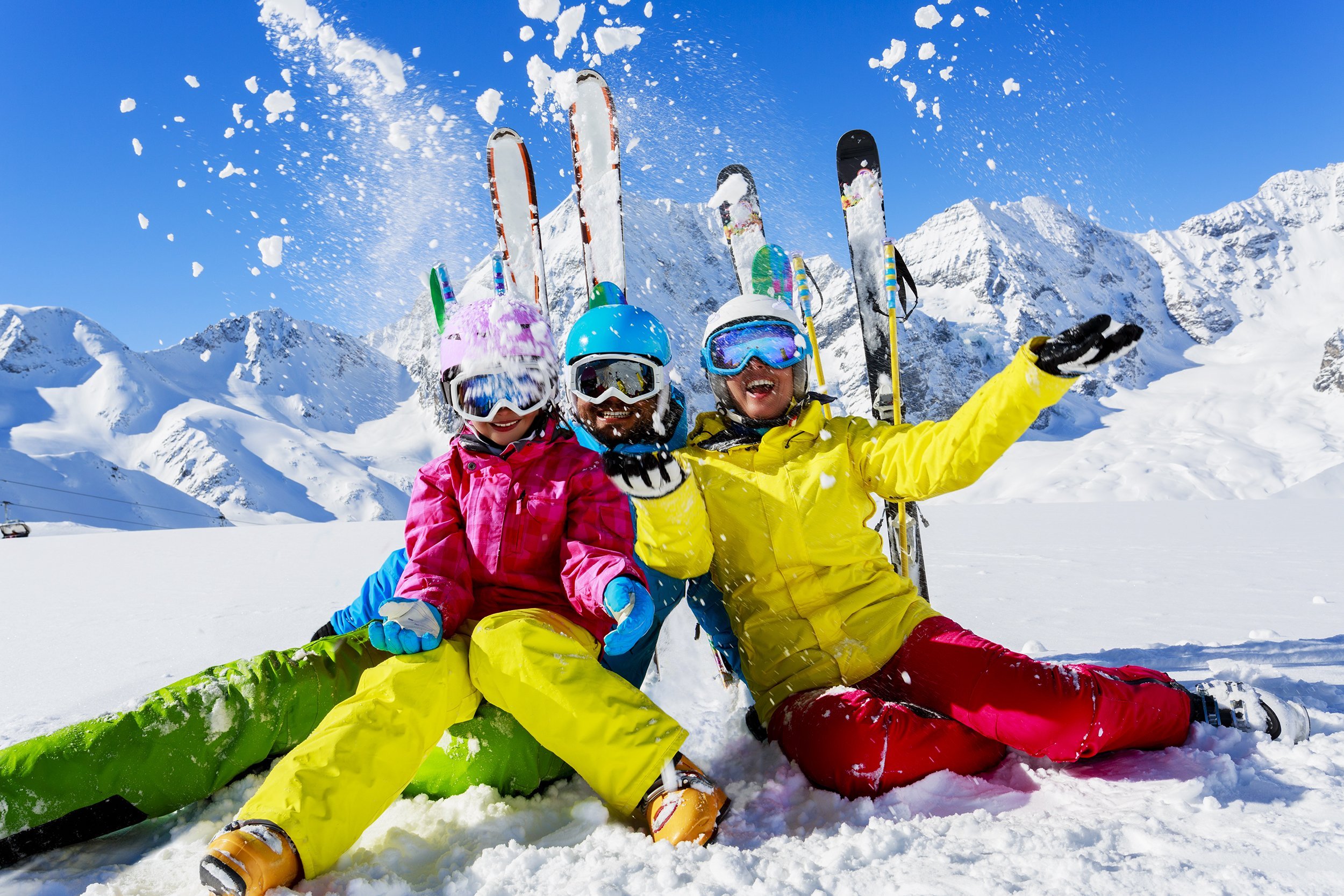 family enjoying skiing