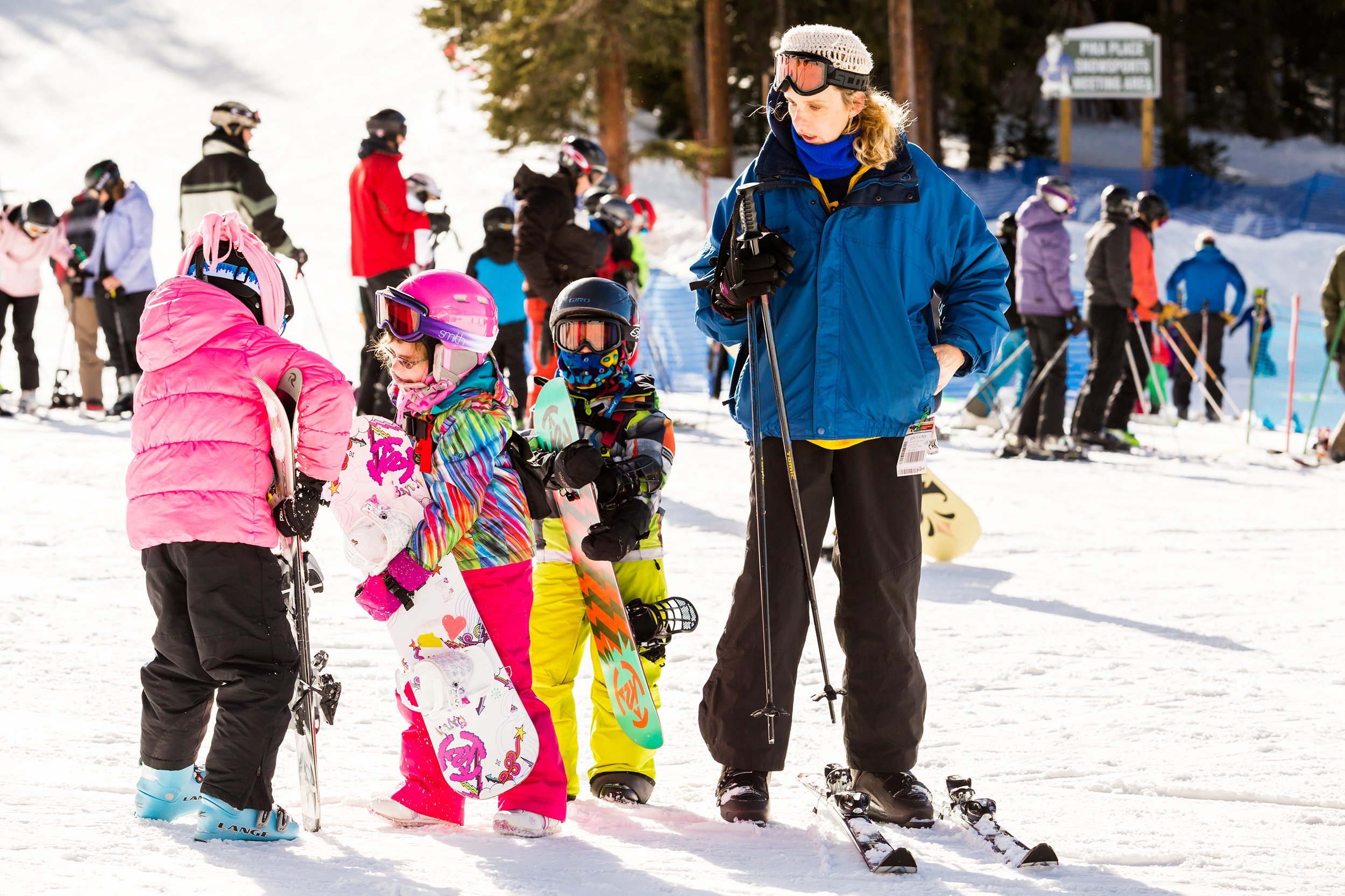 adult and children skiing at Araphoe basing ski resort