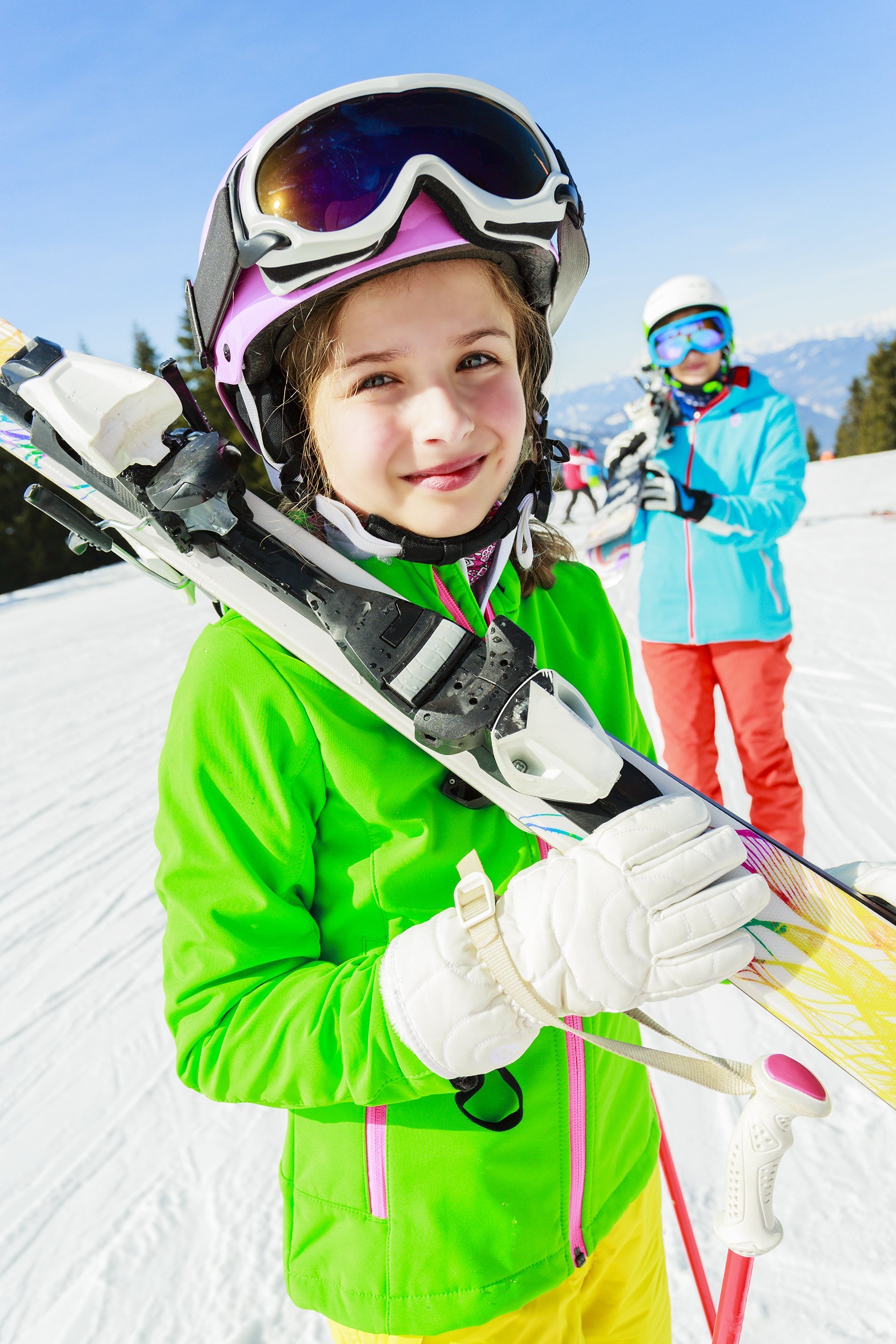 child and adult Skiers enjoying winter vacation