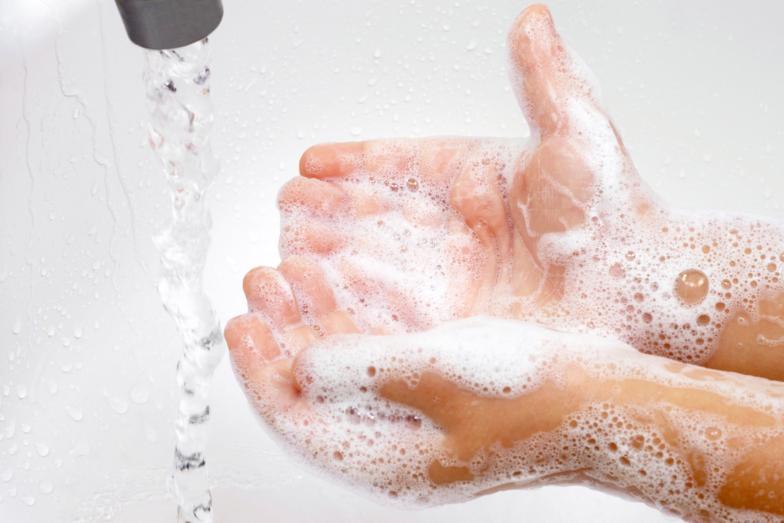 child washing hands