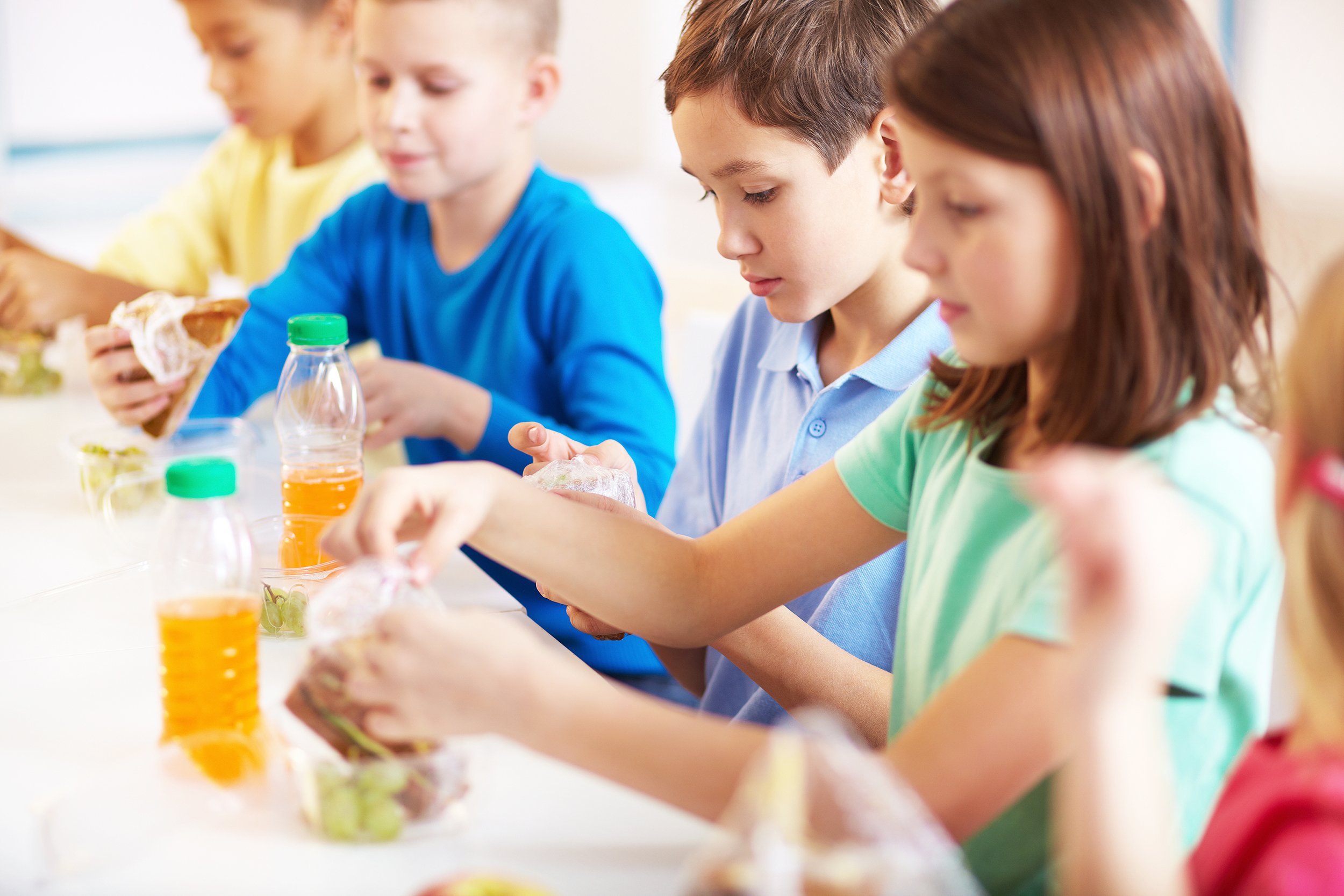 group of classmates having lunch during break