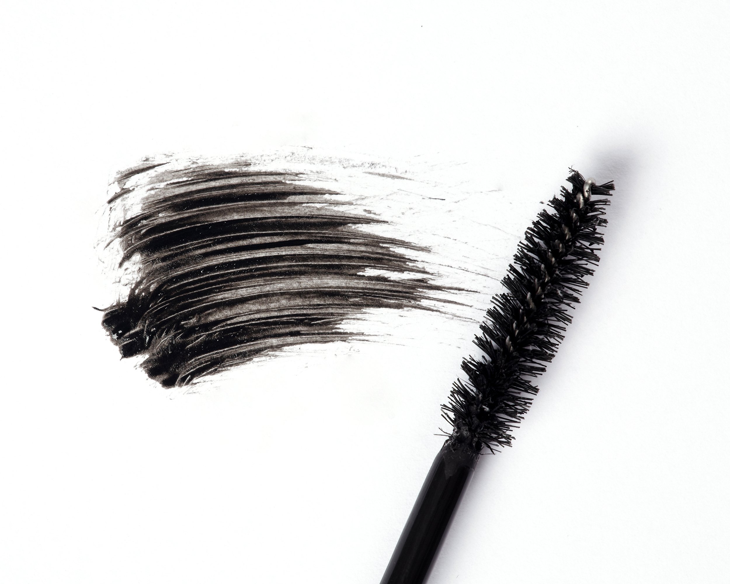 mascara wand and black mascara