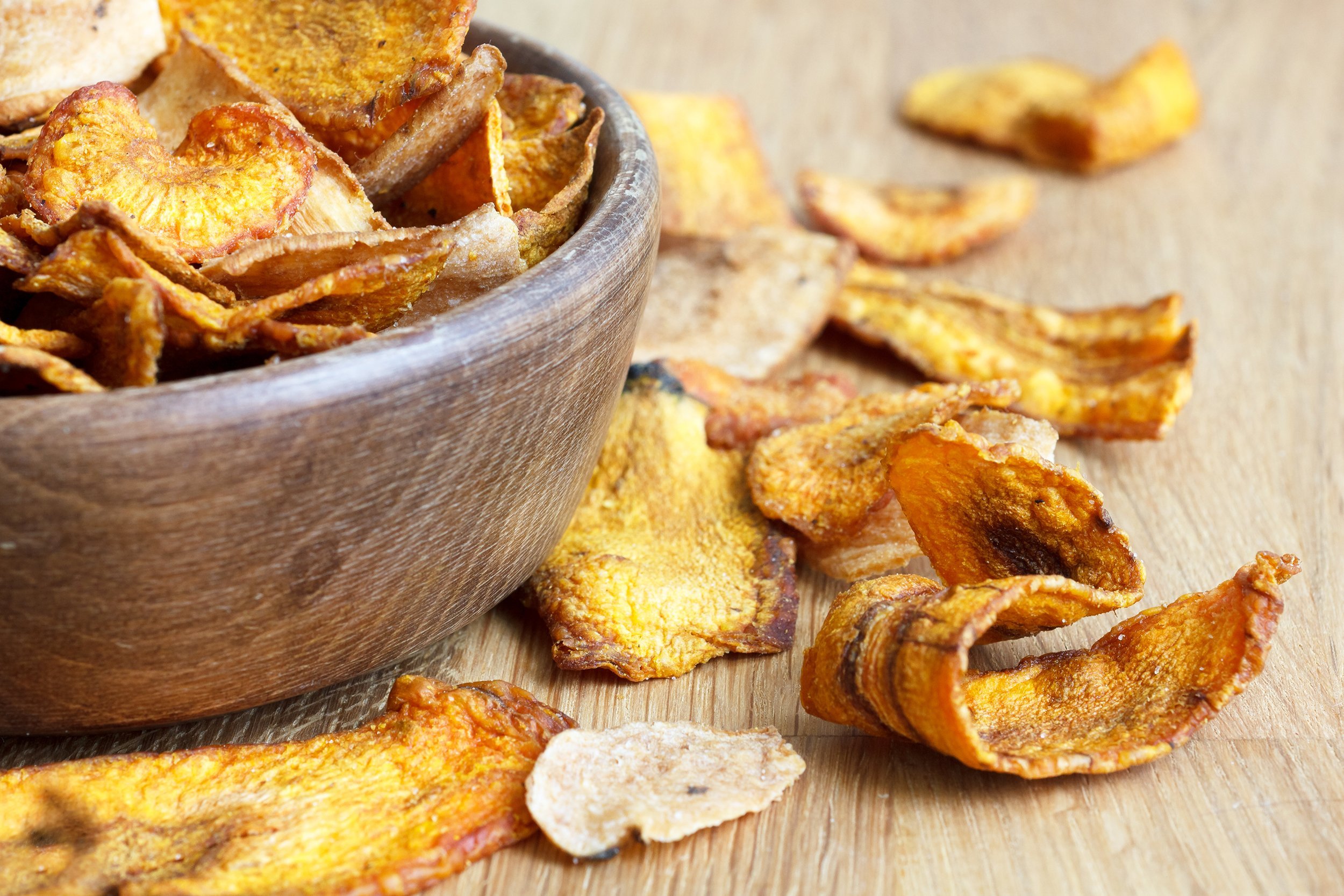 wooden bowl of parsnip and carrot chips