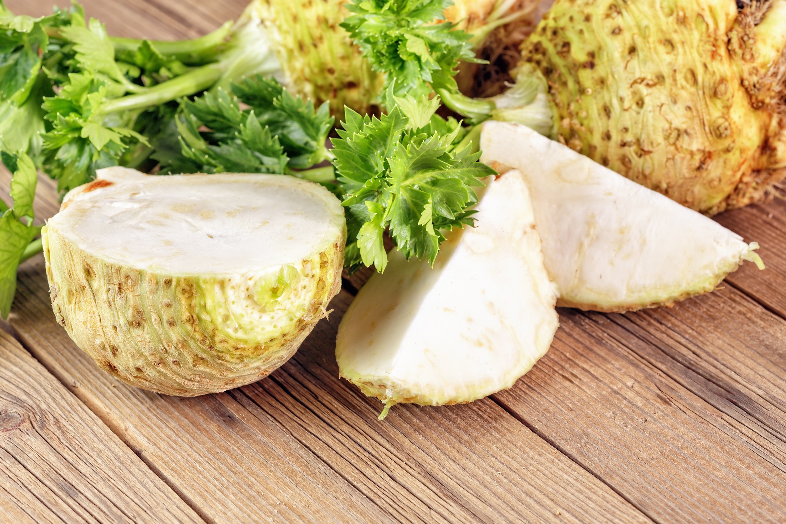 fresh celery root on a wooden board