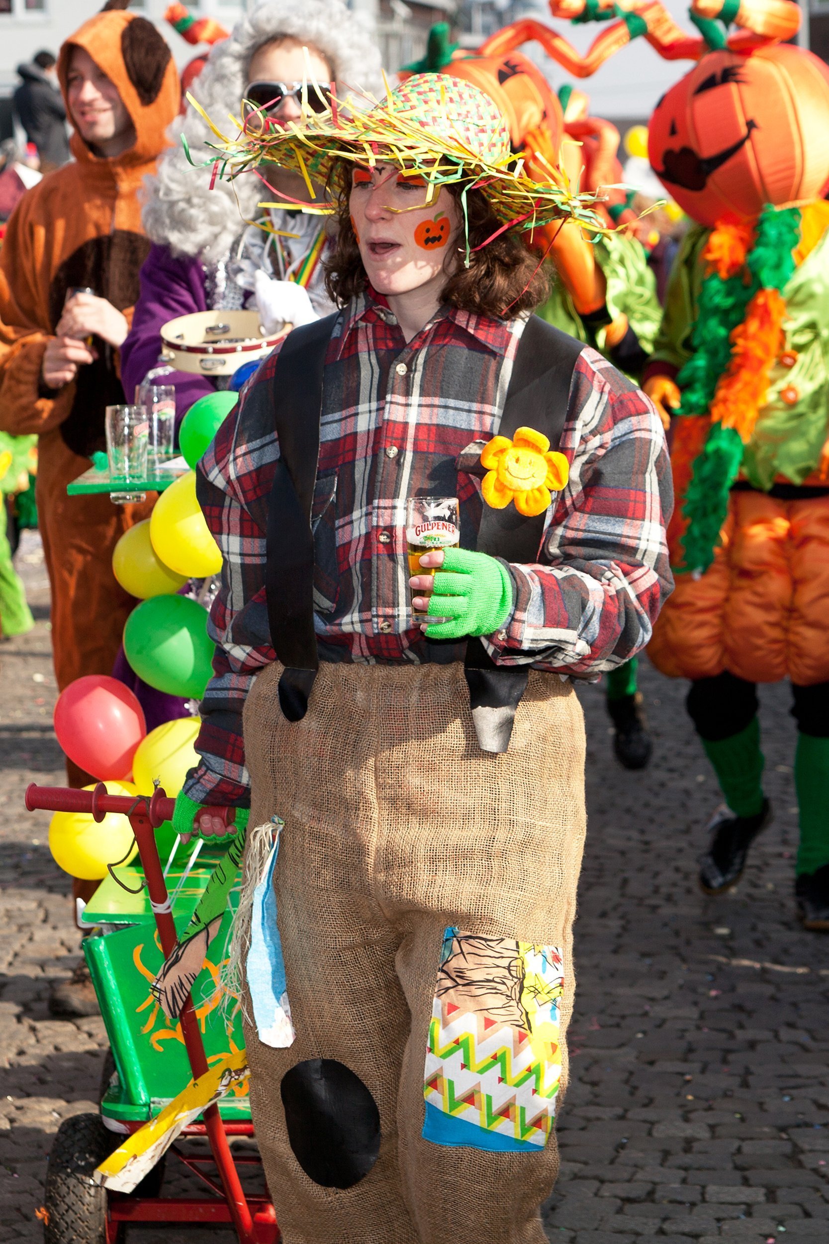 man in scarecrow costume in a Halloween parade