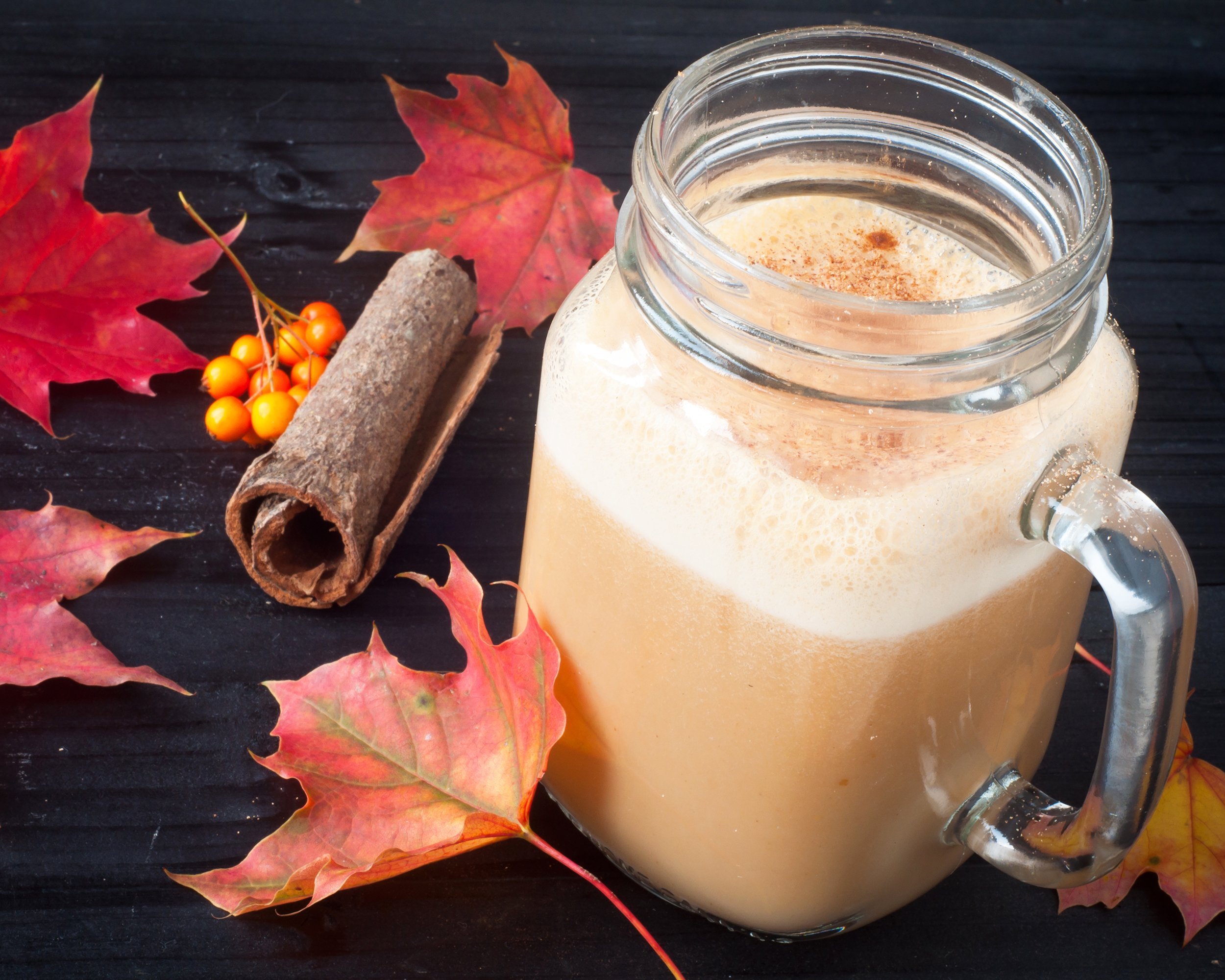 pumpkin spiced latte coffee served in a jug glass