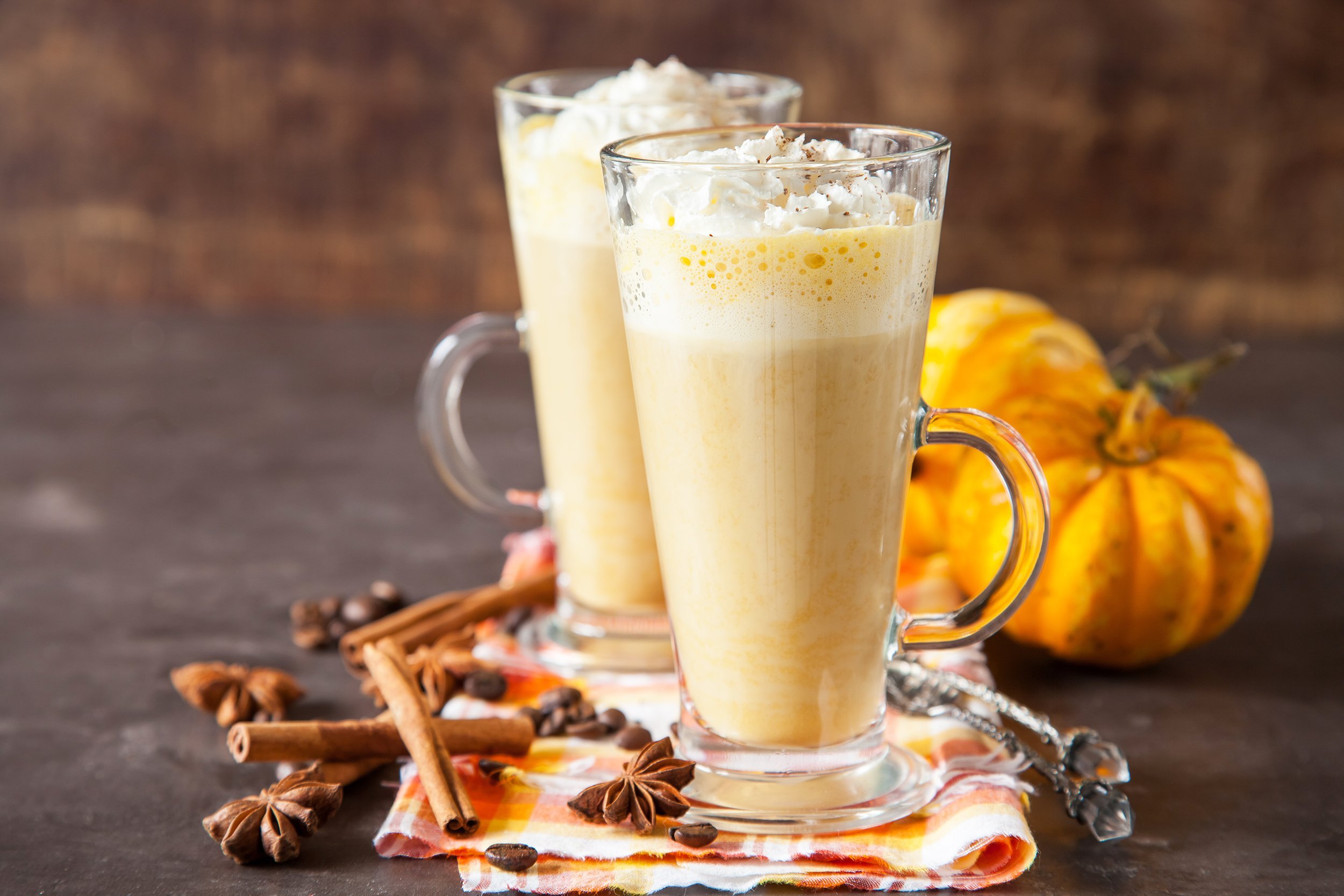 pumpkin latte in a glass on a table