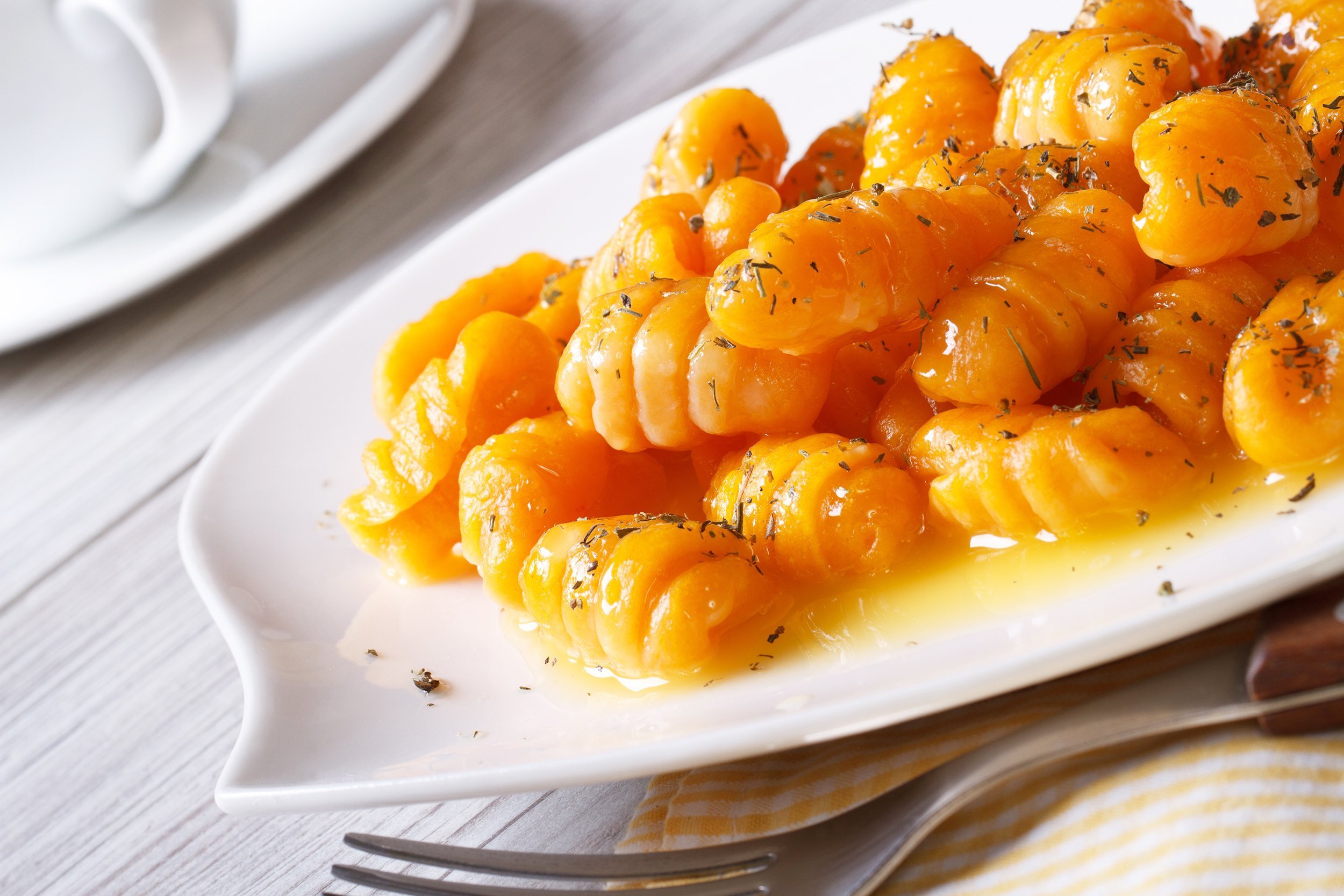 pumpkin gnocchi with butter on a plate