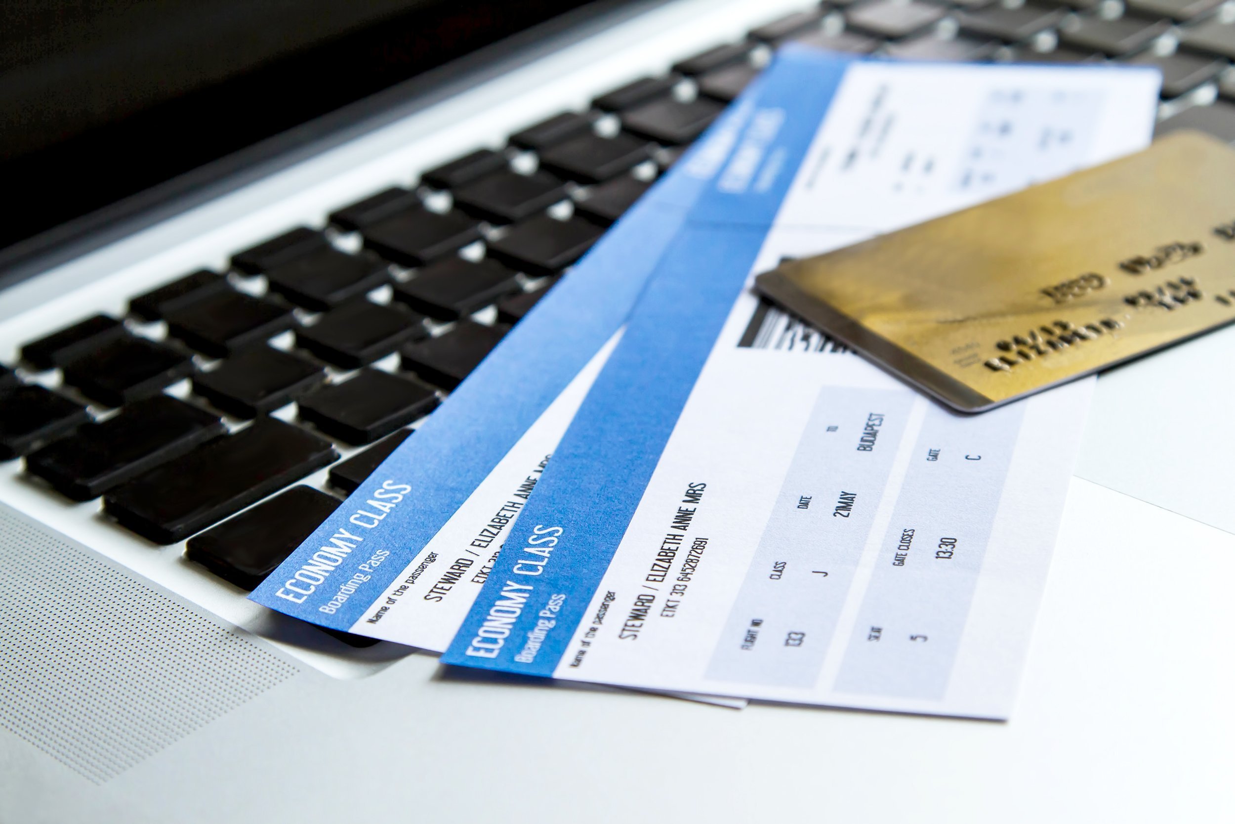 airline tickets with a credit card on laptop