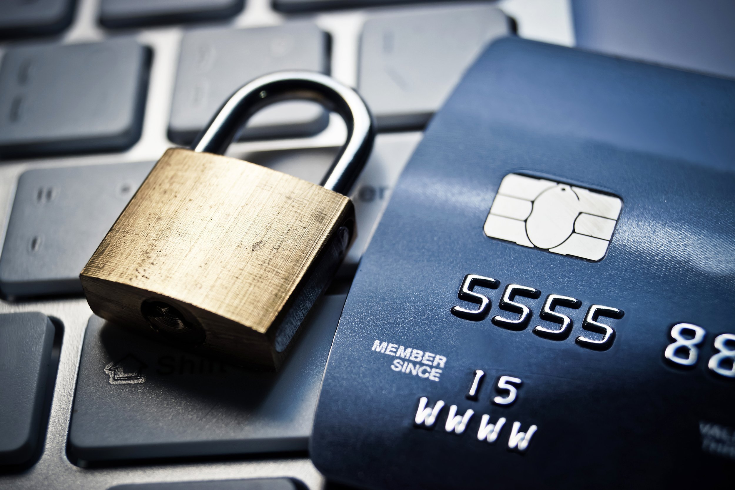 lock and credit card on keyboard