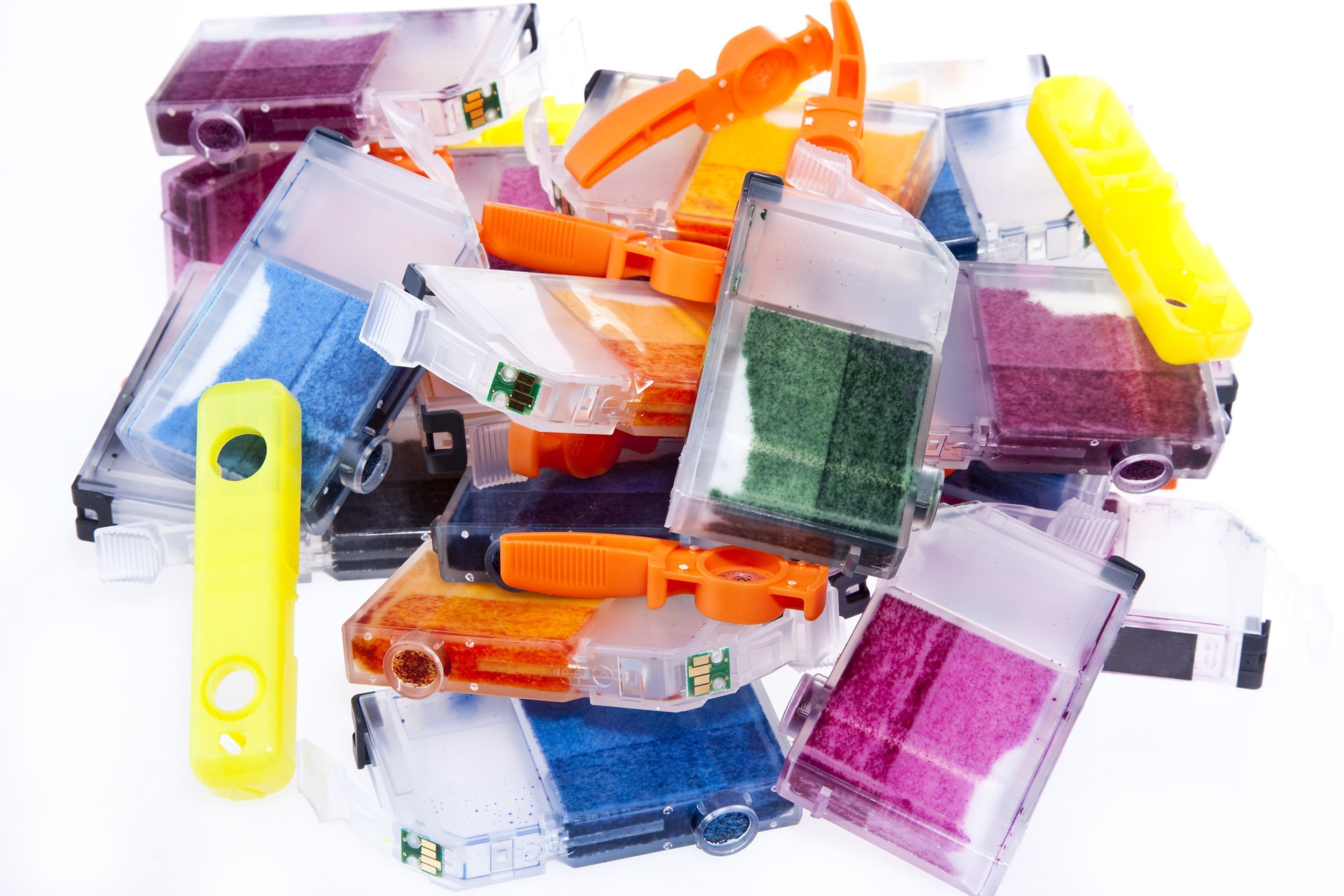 colorful pile of empty inkjet printer ink cartridges