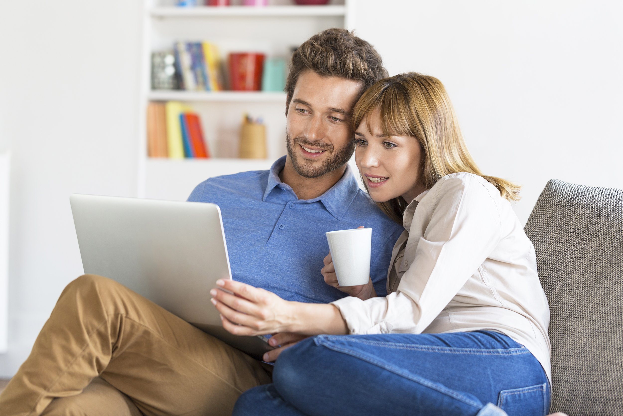 young couple surfing on internet with laptop