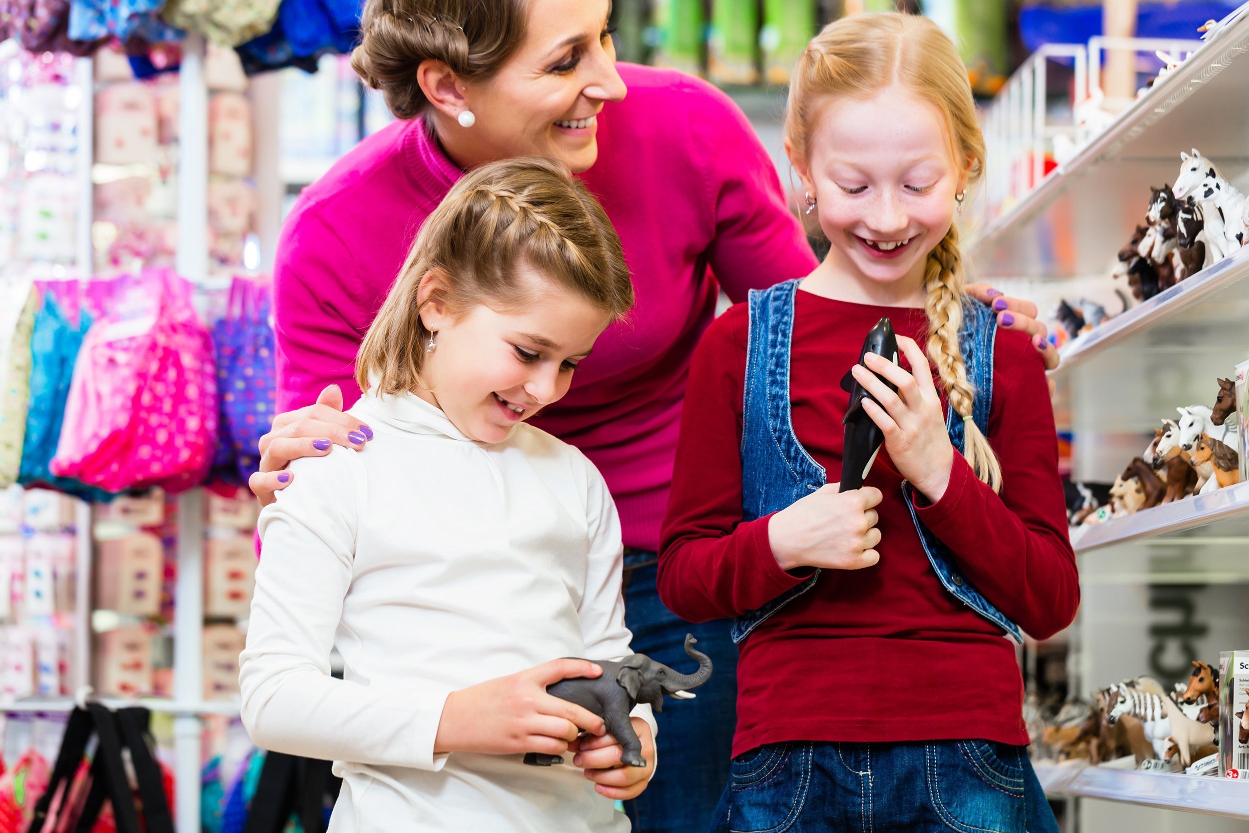 family buying toys in toy store in toy store