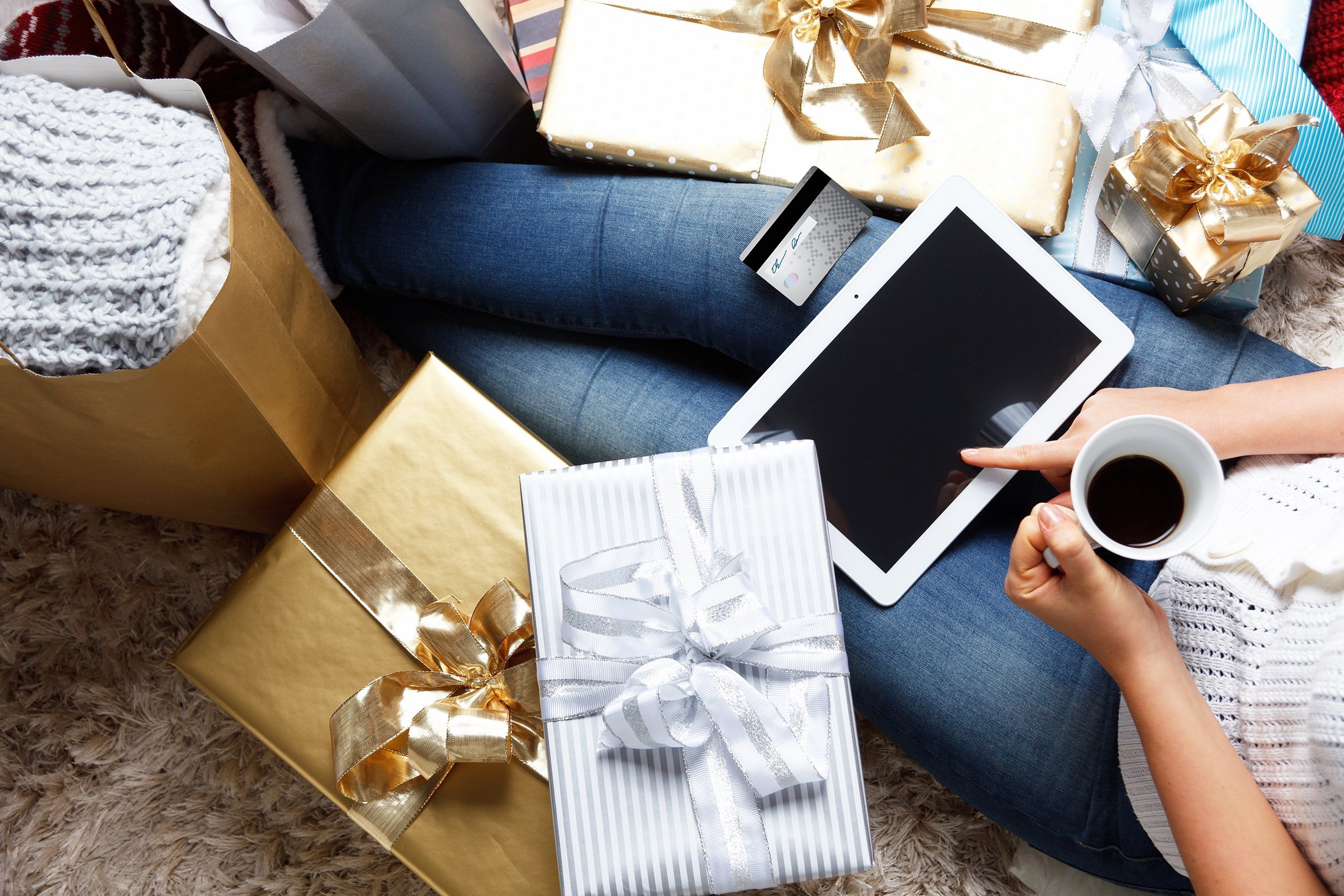 woman shopping online with a credit card