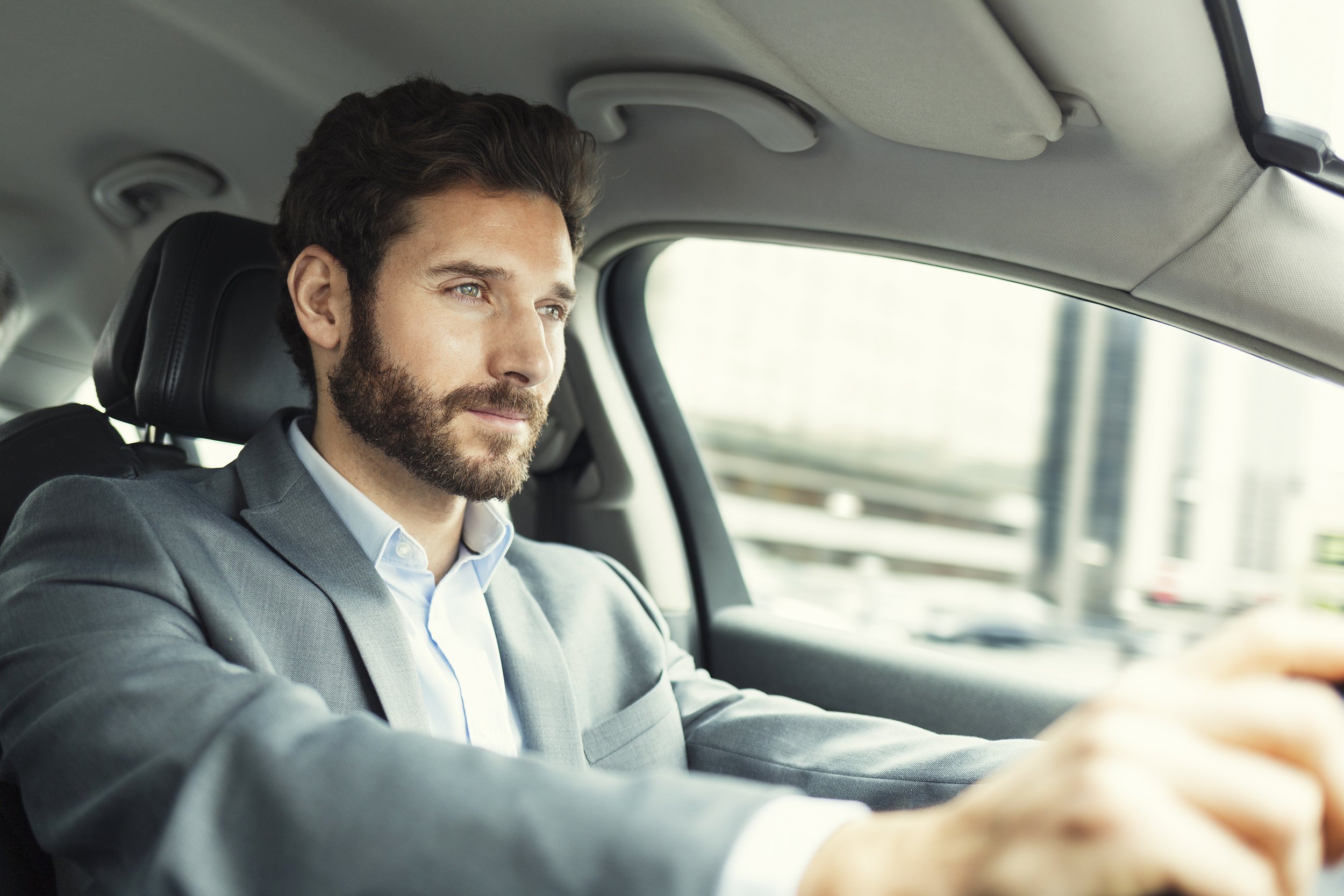 business man driving car