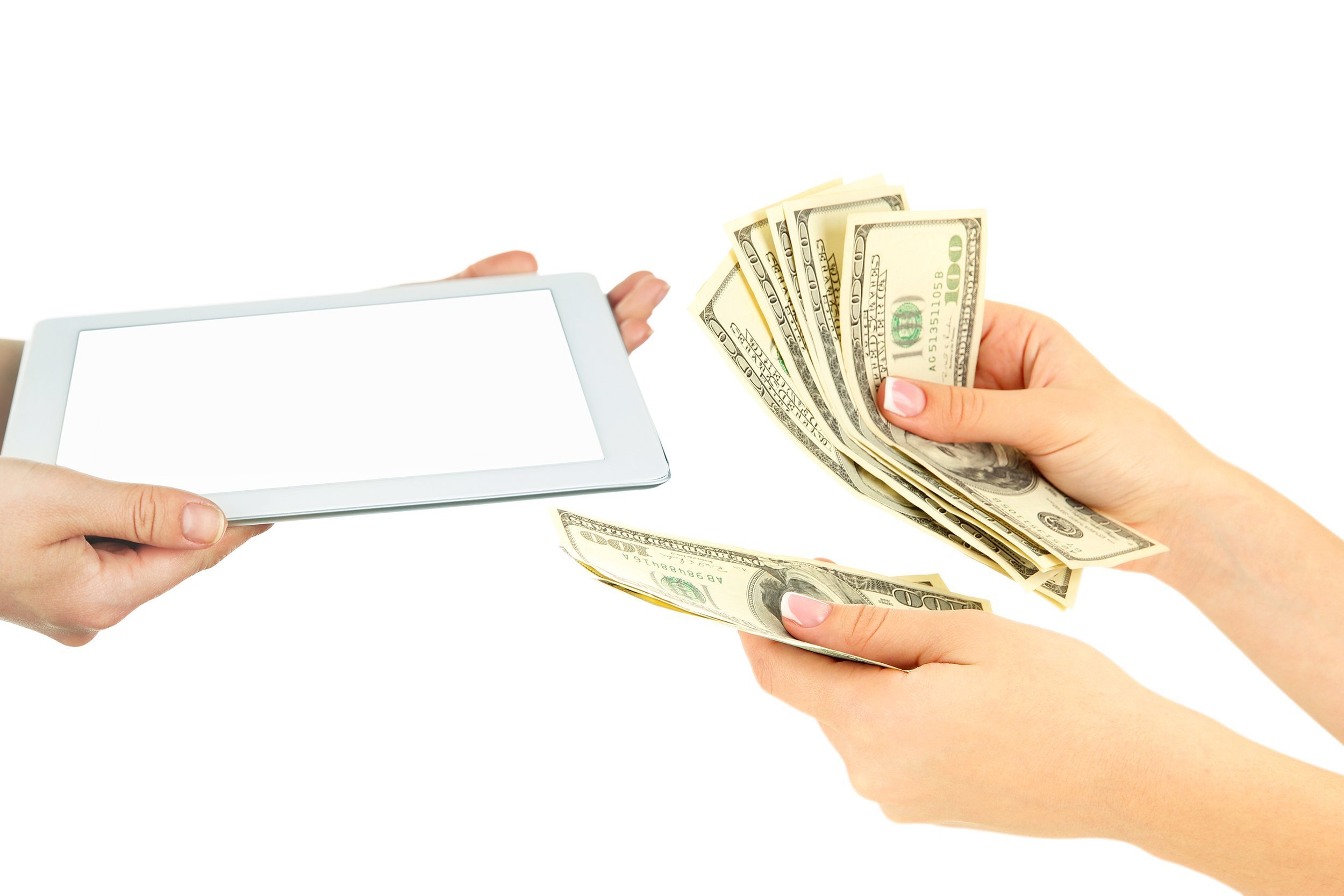 tablet and money exchanging hands