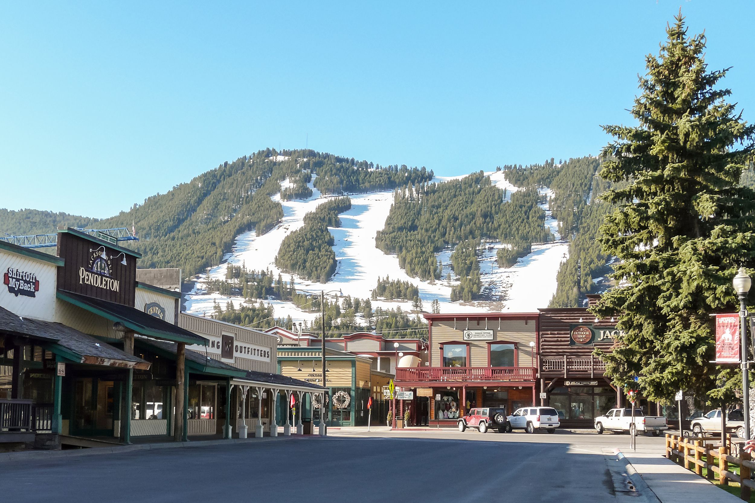 Downtown of Jackson Hole, Wyoming with snow on the mountains