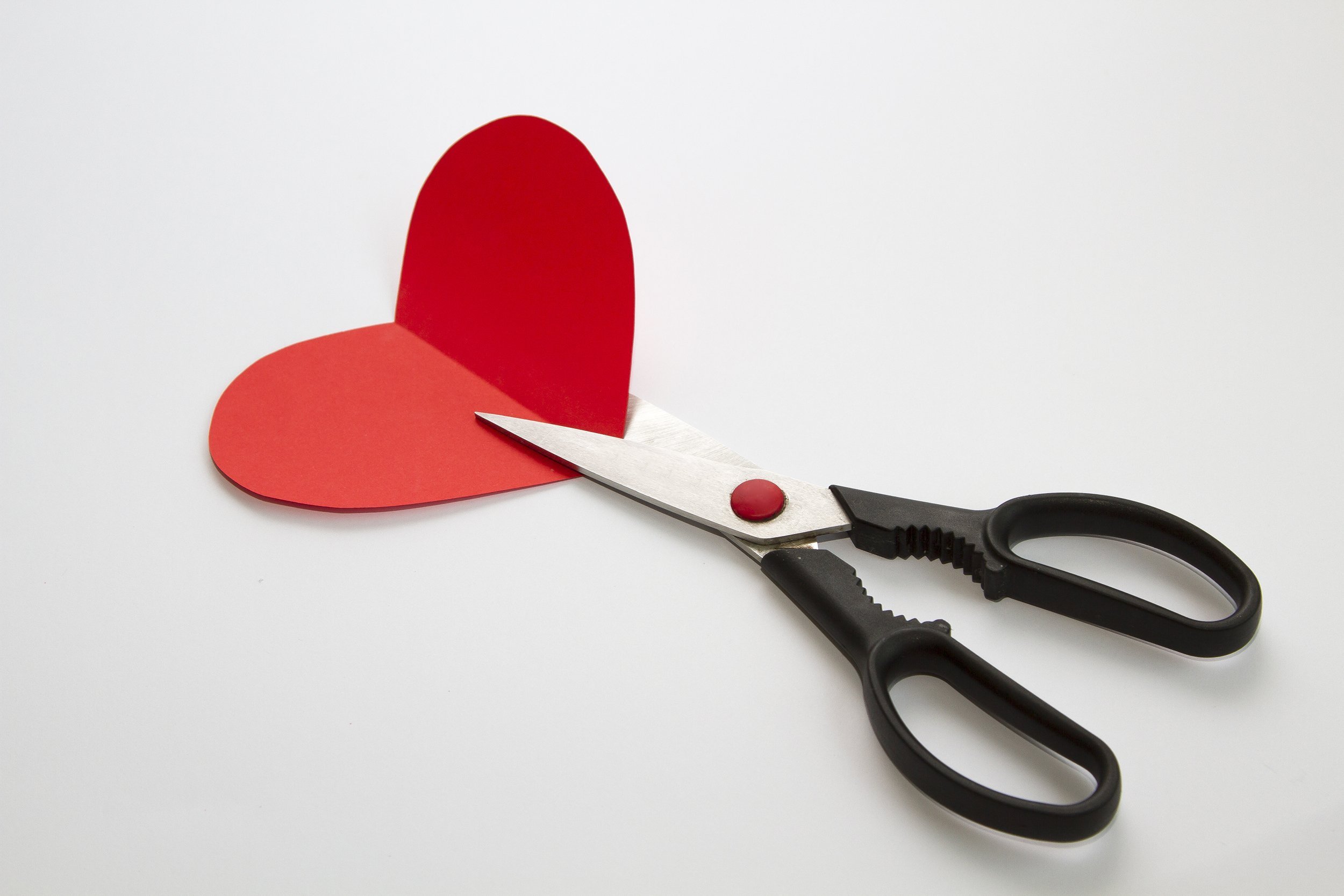 red paper heart and scissors