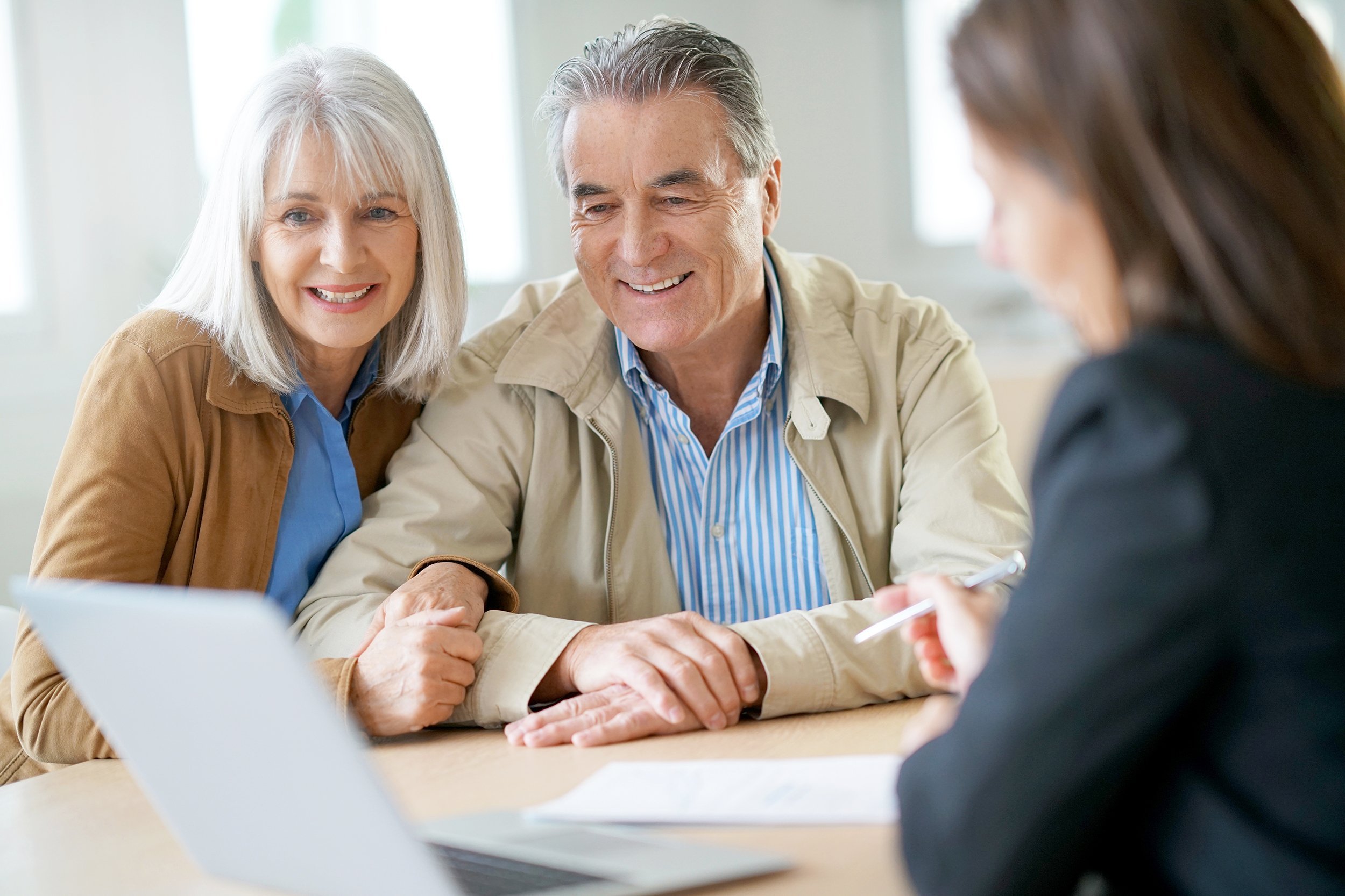 senior couple meeting financial adviser for investment