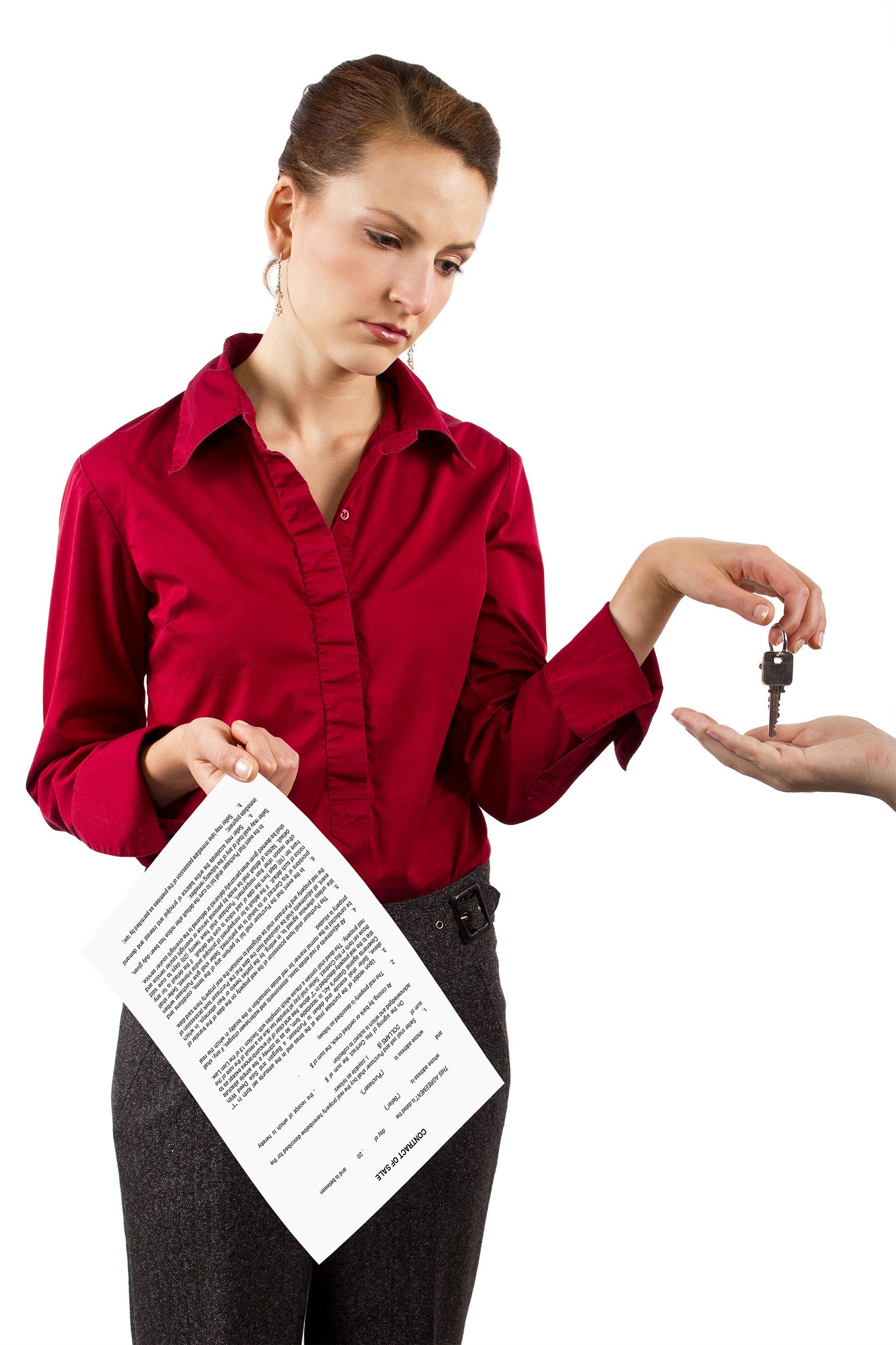 woman holding keys and a deed of sale contract