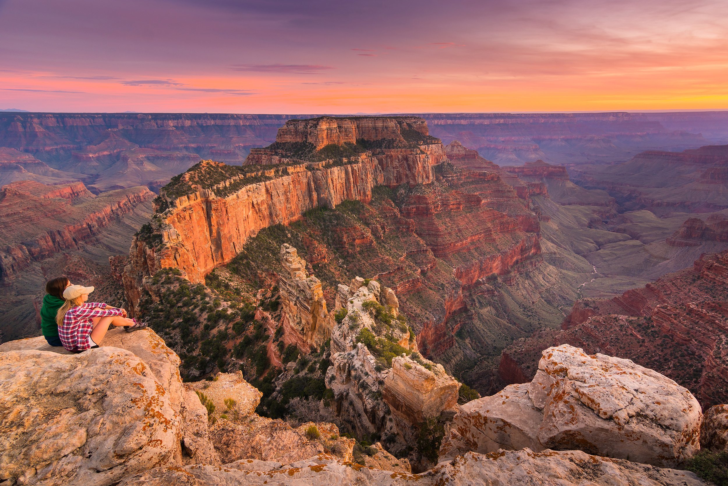 two hikers overlooking Grand Canyon National Park, Arizona
