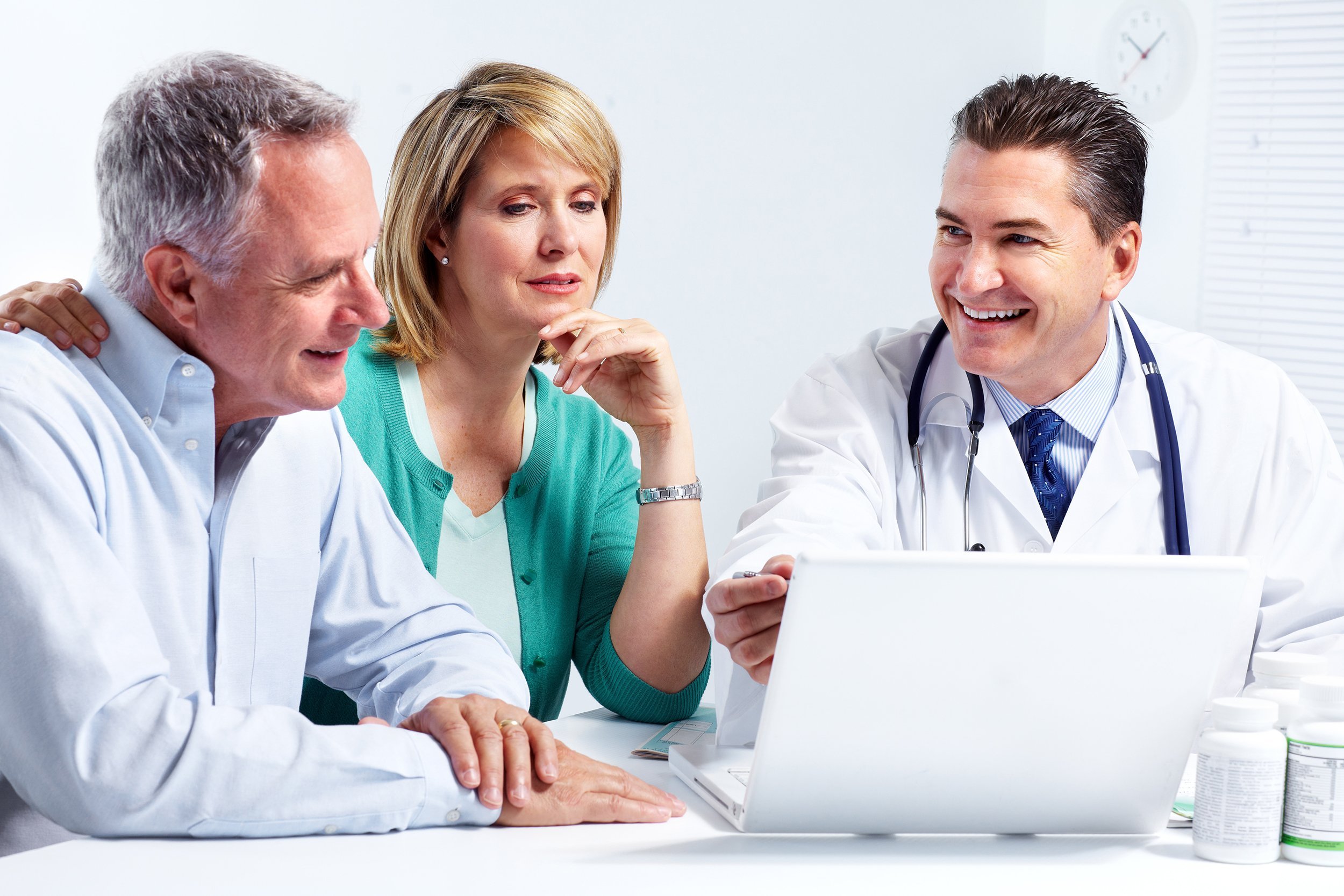 smiling medical doctor with senior couple