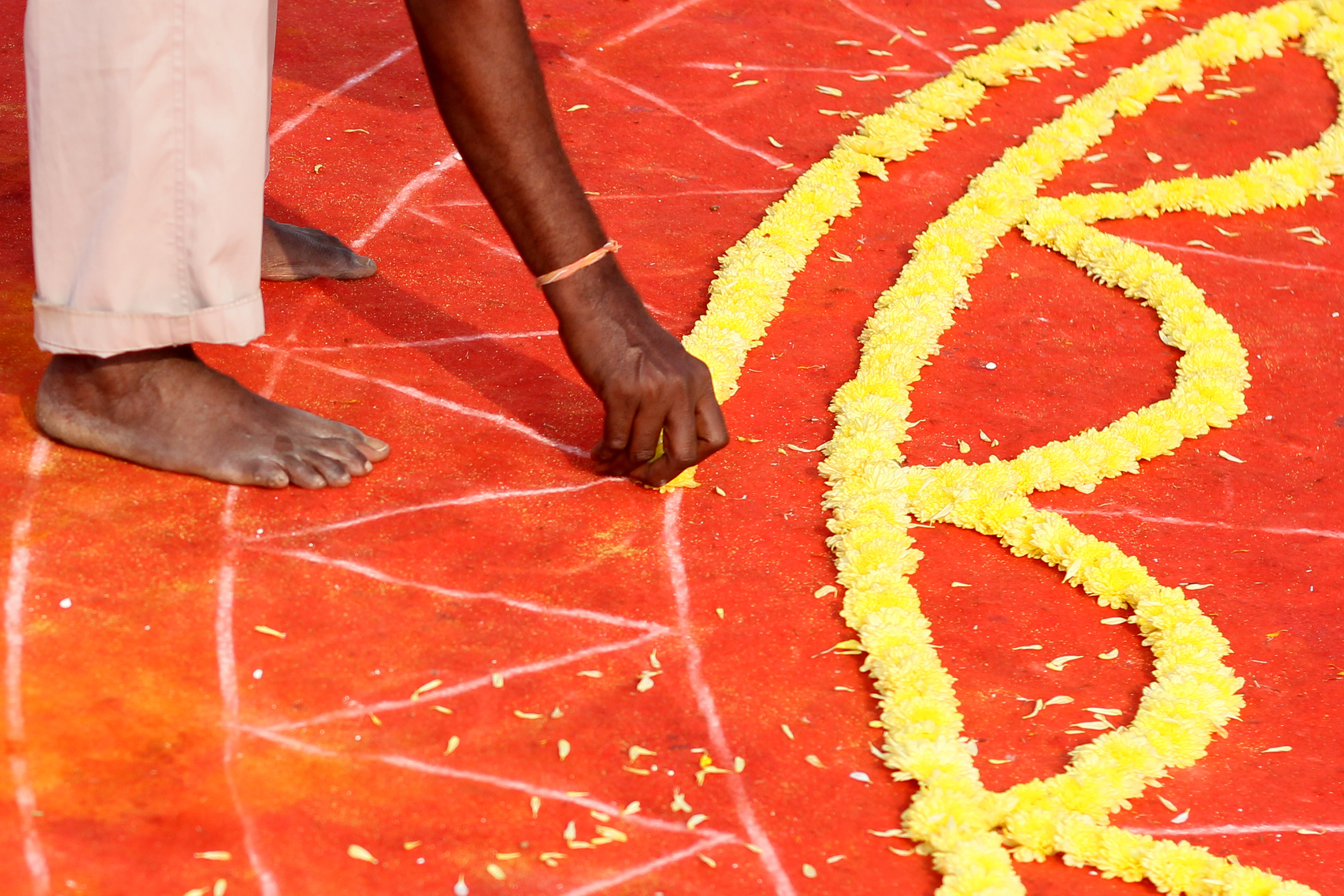 Woman placing flowers on the ground