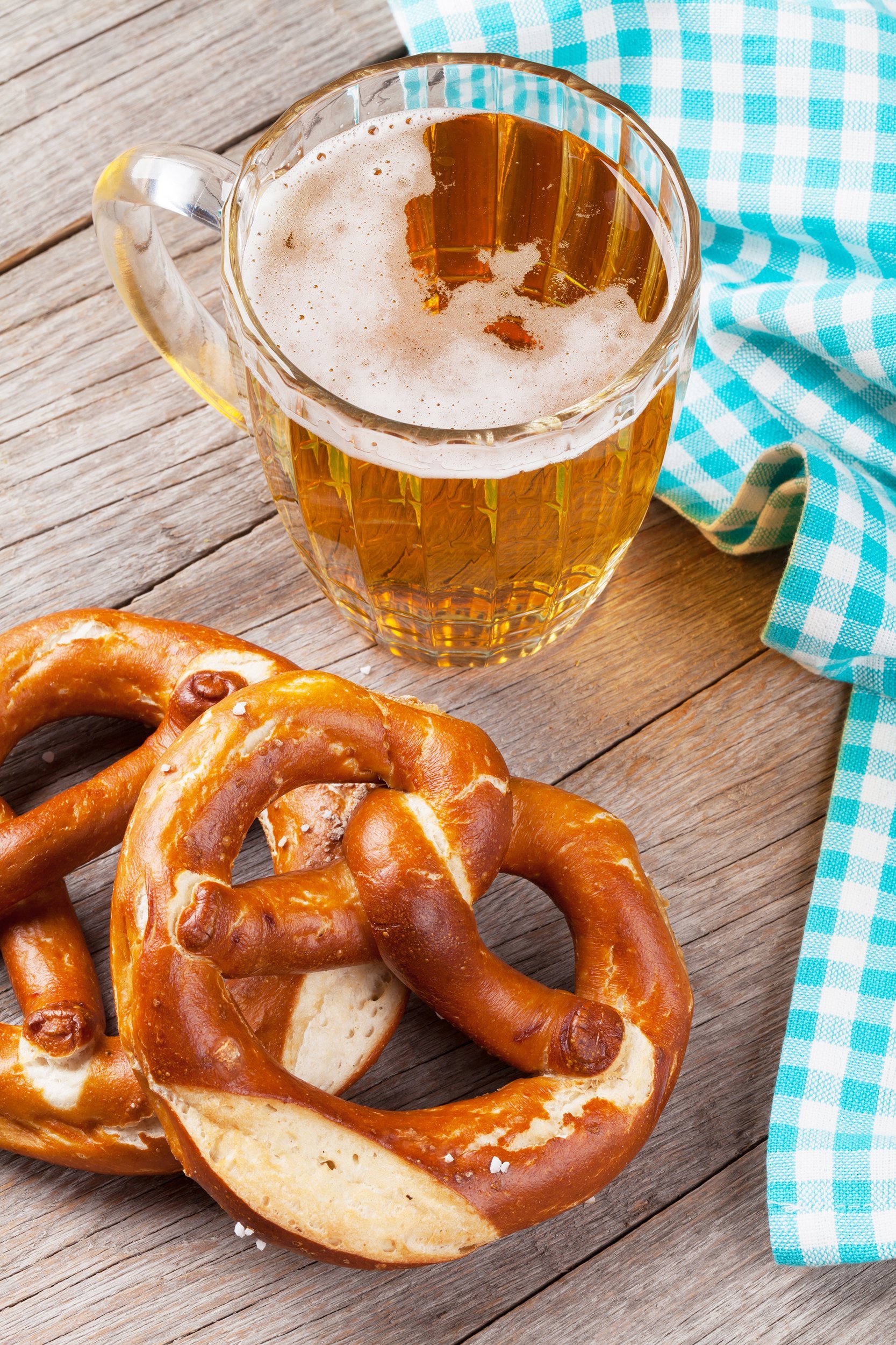 beer mug and pretzel on wooden table