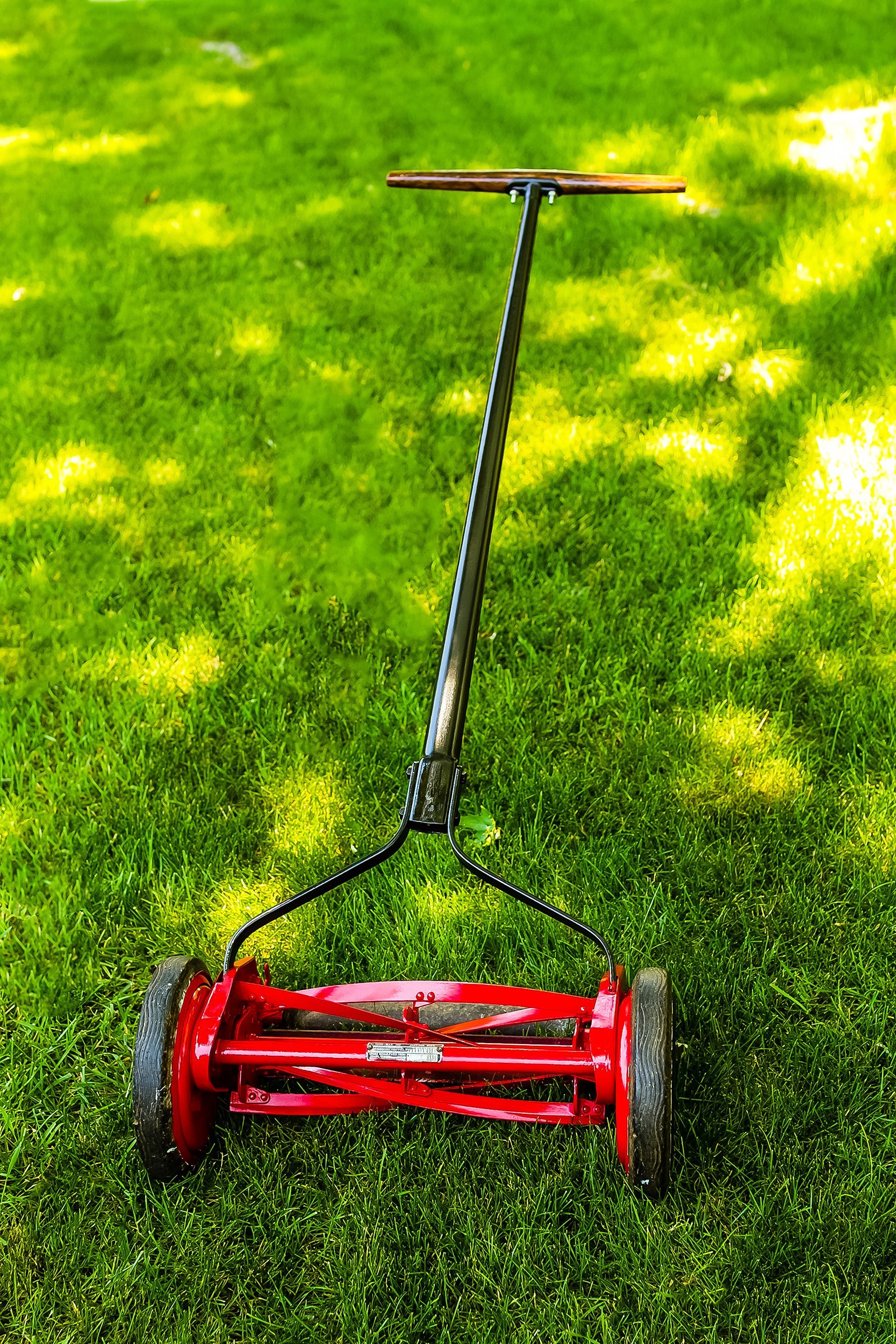 refinished manually powered lawn mover