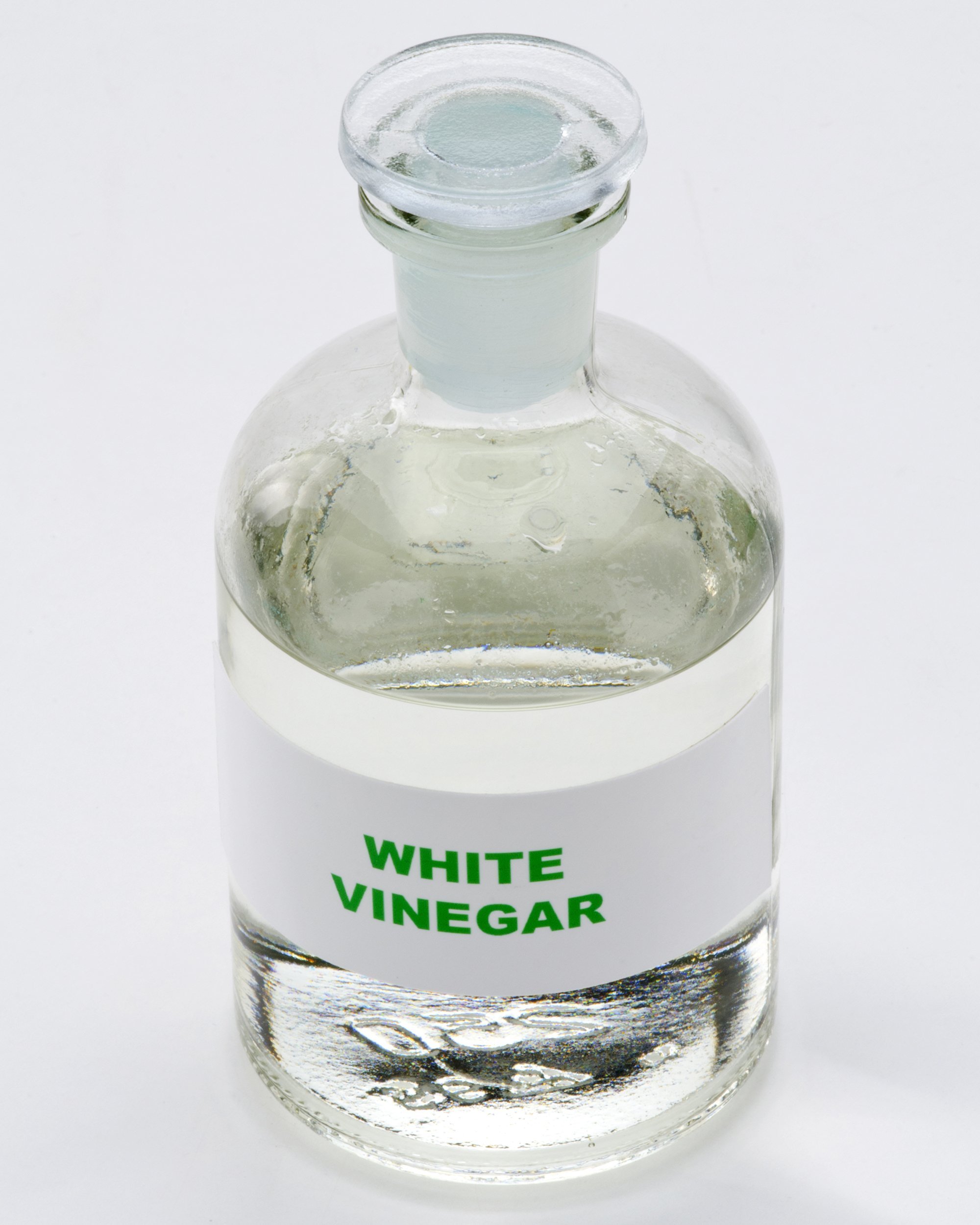 white vinegar in a glass bottle