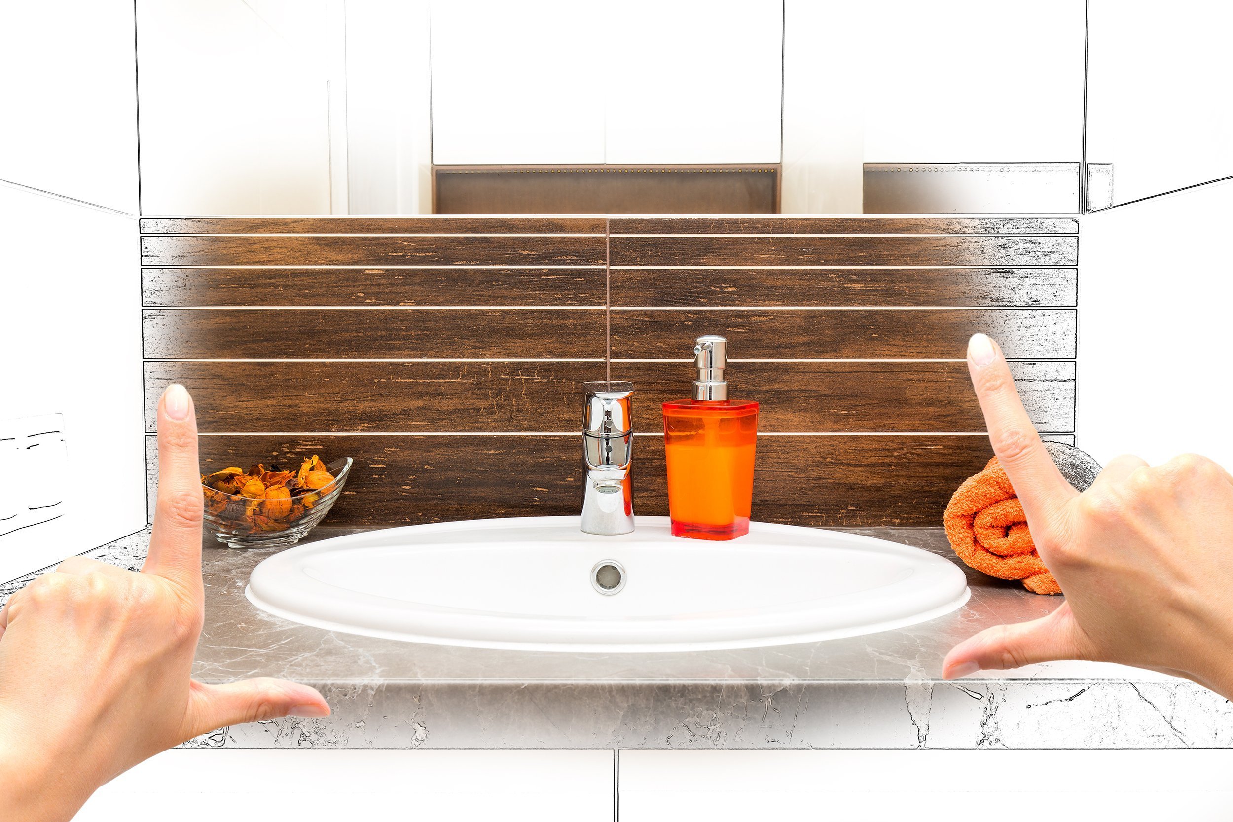 female hands framing custom bathroom design