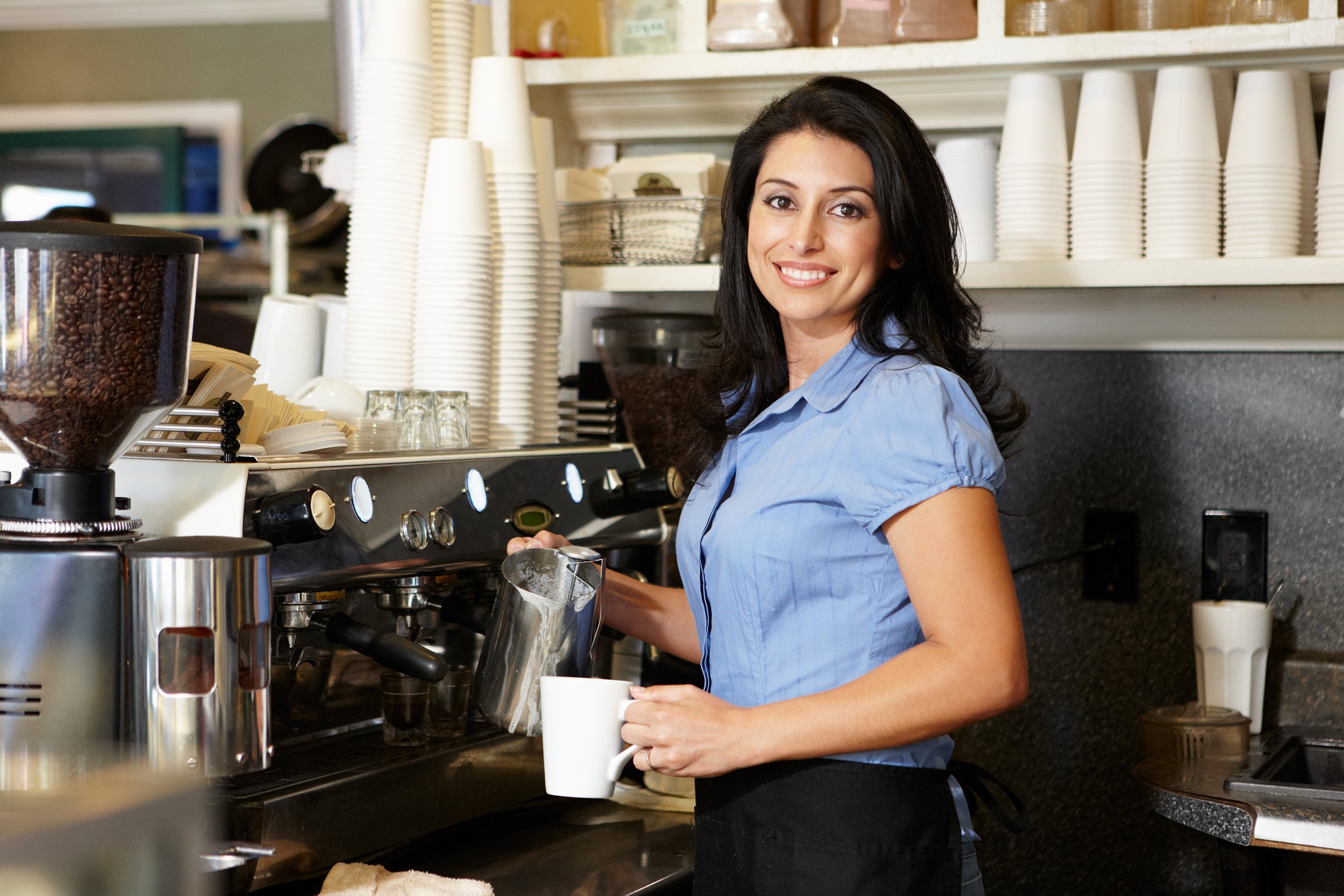 woman working on the cafe